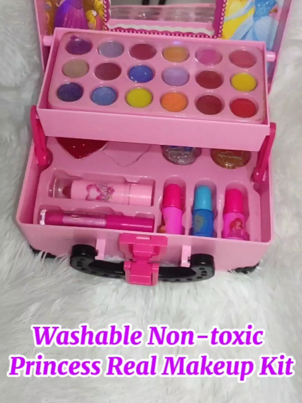 A fun and colorful kids' makeup kit featuring a Disney Princess theme! The pink case opens up to reveal a wide variety of vibrant eyeshadows, glittery lip glosses, nail polishes, and more beauty essentials. With adorable princess prints and sparkly accessories, it’s perfect for little ones who love pretend play and glam time! #makeup #kids #kidsmakeup #realmakeupkitforkids #makeupkit #fyp 