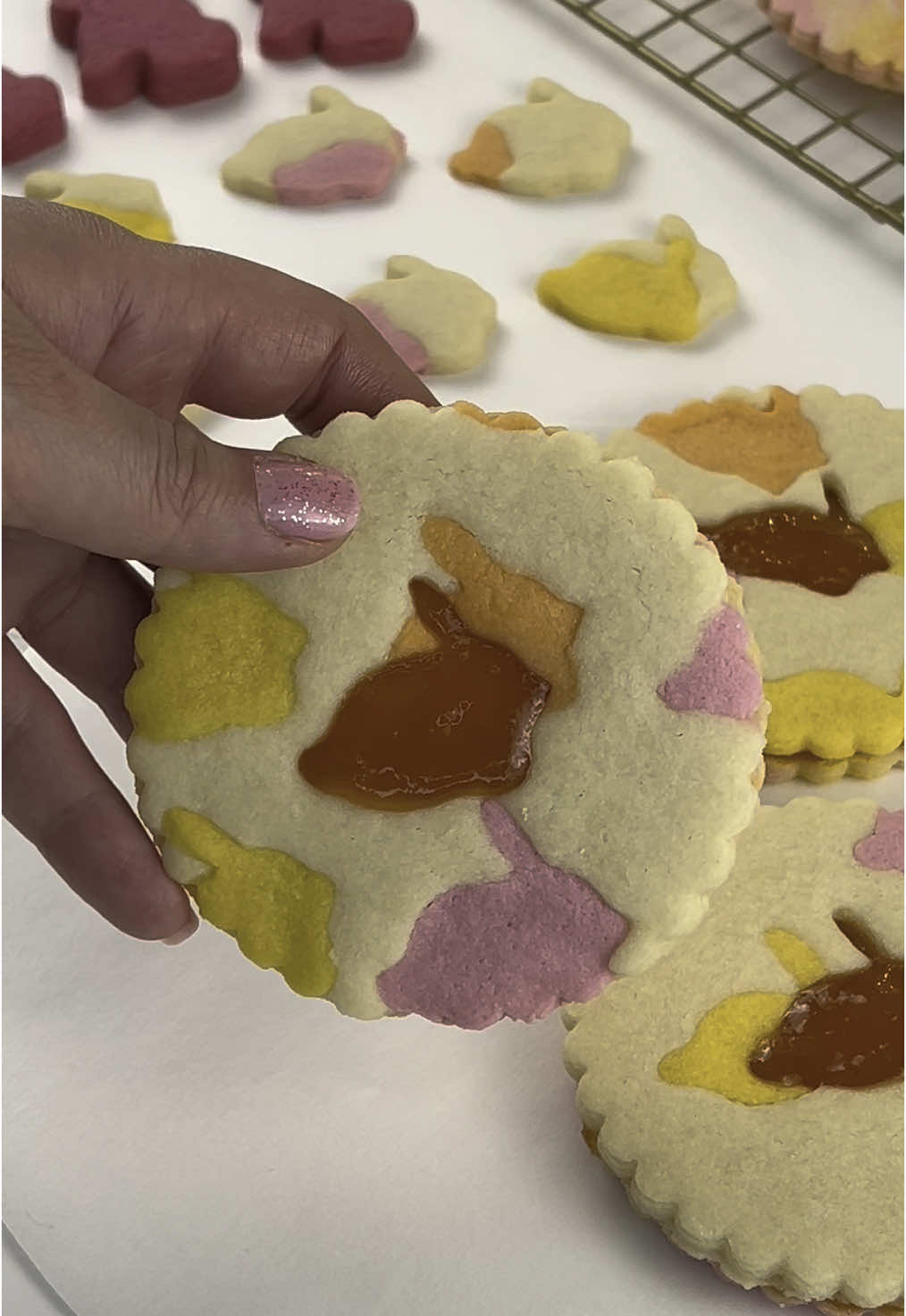 Colourful Easter Cookie🐰🌈 Here’s a playful way to bring pattern and colour to your Easter treats! 🍪 Here’s how I made them: 💛 Base: Classic sugar cookie dough 🎨 Colour Pop: Mixed in pink, lemon, and orange dough 🐰 Shape: Cut bunny shapes from colorful dough & placed them into the base 🌼 Outer Cut: Used a large flower-shaped cutter to shape the cookies 🐰 Center Cut: Removed the middle with a mini bunny cutter for the top cookie 🍑 Filling: piped apricot jam on the solid cookie 🧁 Finish: Sealed both halves together for a vibrant flower cookie with a #bunny #jam center! ✨ So simple, so cute, and full of springtime charm! Would you try this for #easter brunch or a #spring picnic? 🌷 #easter #easterbunny #bunnycookies #eastercookies #sugarcookies #sugarcookiedecorating #eastertreats #easterbaking #easterrecipes #easterdessert #easterideas #easterfood #easterbasket #springbaking #easydessert #fyp #viral_video_tiktok #supportsmallbusiness #ellybakehouse
