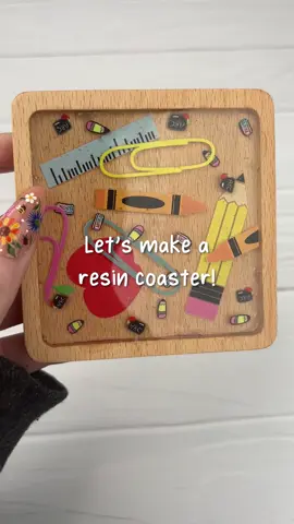 ✨ Take coaster designing to the next level! This 3D coaster is the perfect #gift for your favorite teacher! 📓 Layer resin and UV DTF to create cool dimension in your coaster! ✂️ Materials - • Wood Coaster Square Raised Edge - Brown • Let's Resin UV Resin - Hard • UV DTF Wrap - School Days • Poly Clay Slices - School Eraser • Poly Clay Slices - School Pencil • Poly Clay Slices - School Chalkboard 🌟 Want to recreate this project? Shop project materials on our site! 🔗 in bio! #coaster #resin #craft #teacher #tutorial #howto #DIYCraftWarehouse