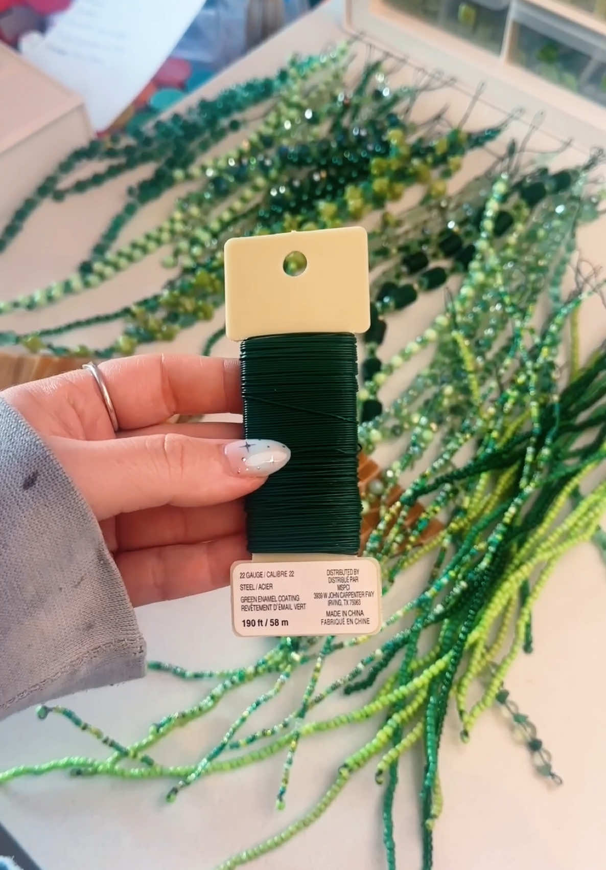 Replying to @TwoDogsAndACat ✨22 gauge green wire✨ #zenspiredesigns #SmallBusiness #beadedplant #beadplant #mosaic #mosaicart #greenbeads #beadedflower #DIY #satisfying #oddlysatisfying #asmr #organizing #beadspinner 