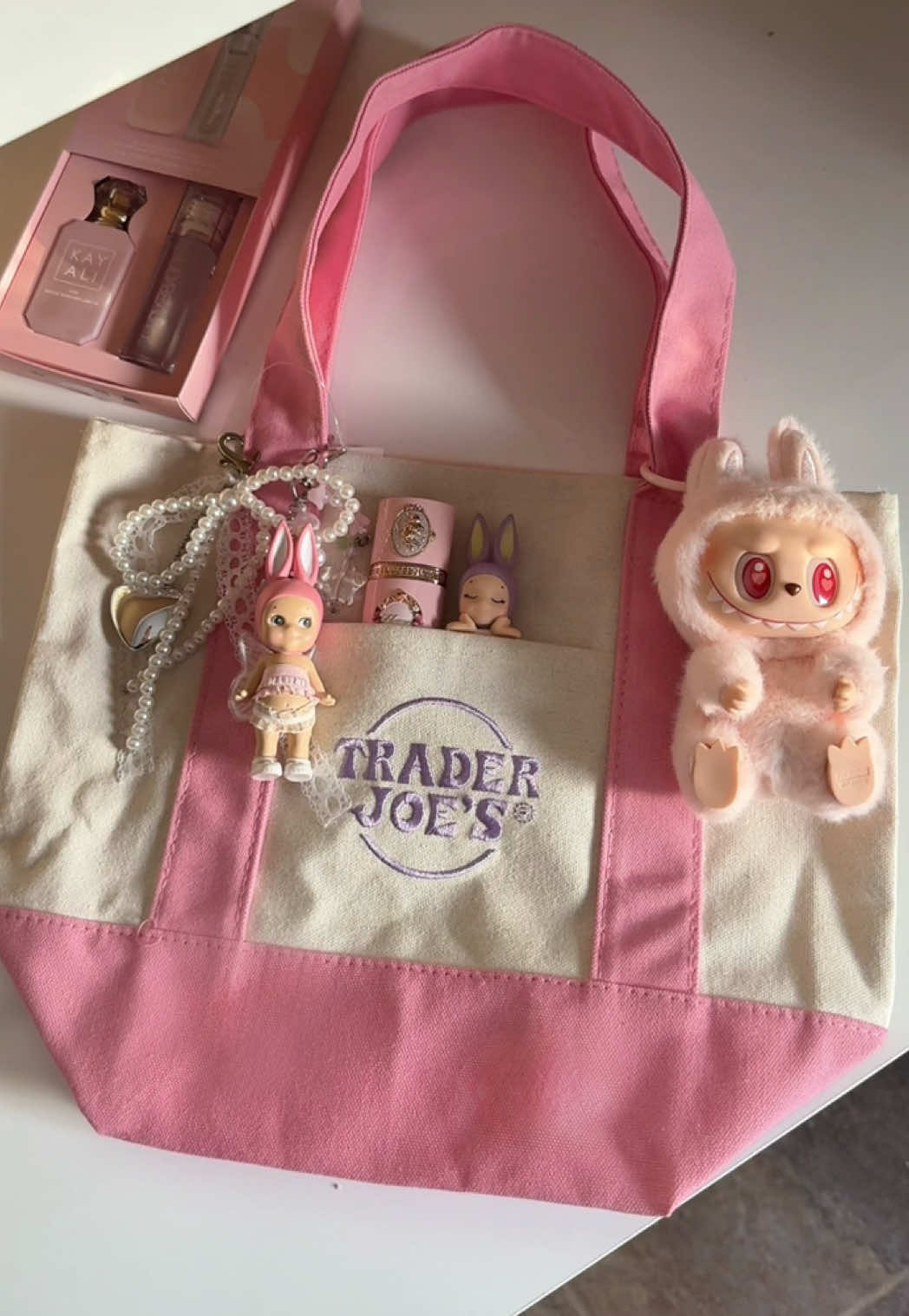 So obsessed with my pink tote bag🎀🌸💗 #traderjoes #traderjoestotebag #labubu #sonnyangel #kayaliperfume #flowerknows #pinkaesthetic 
