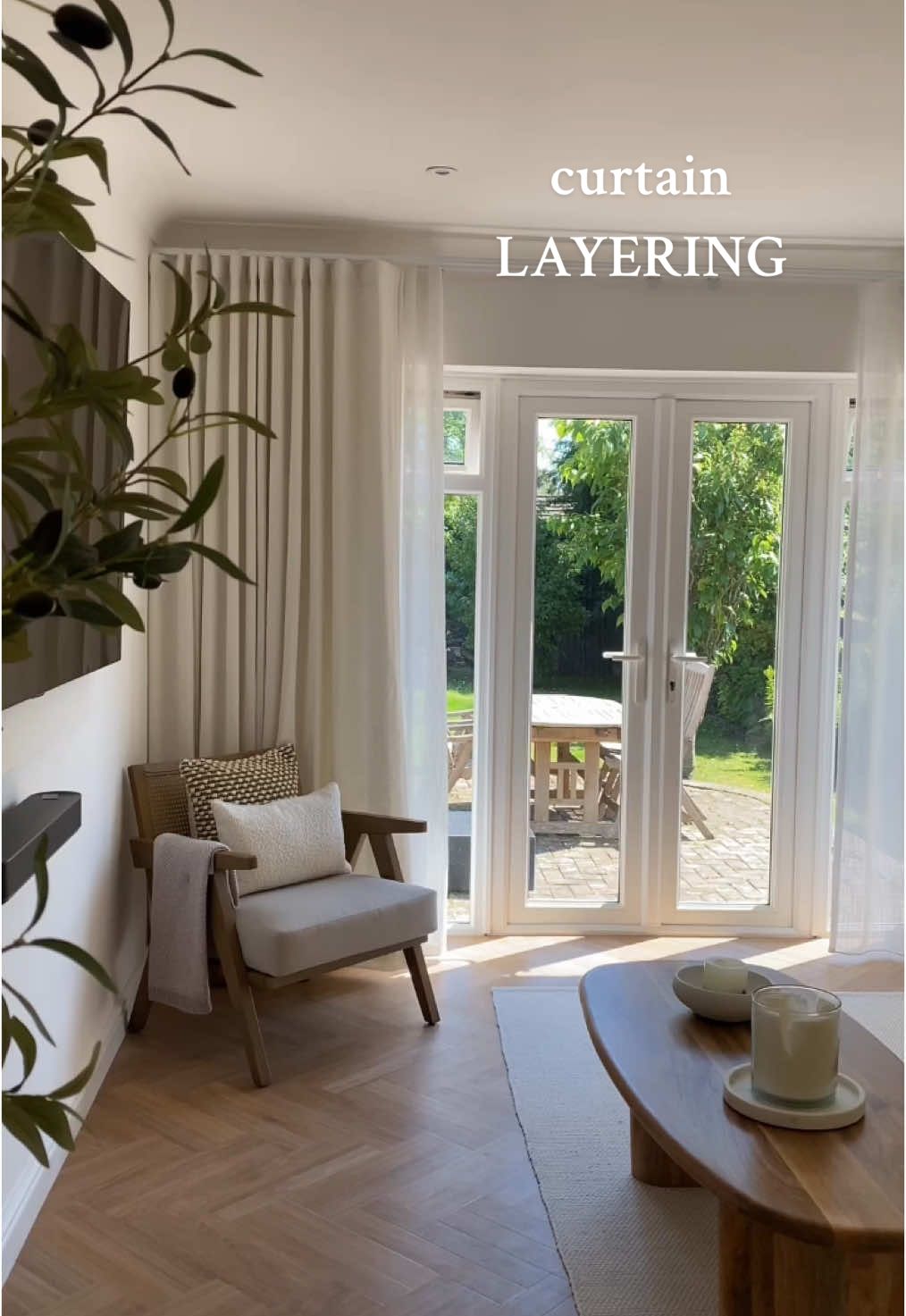 Soft neutrals, cosy textures, and that perfect layered curtain combo ✨ poppysparks_ has chosen the Aubade Voile Curtains & Arcus Snow Curtains making the living room feel dreamy, relaxing and so stylish. #blinds2go #interiorstyling #homestyle #homedecorideas #livingroom #neutralaesthetic #neutralhome 