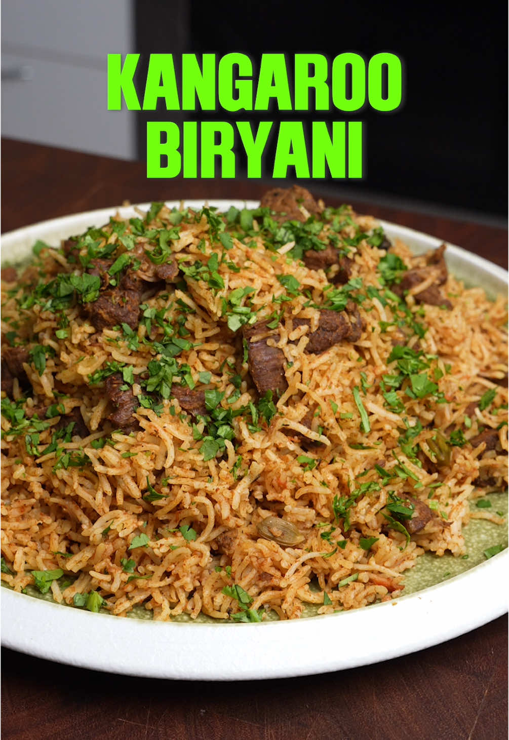 Kangaroo Biryani Cook time: 2 hours Yield: 3–4 servings Ingredients: 500g diced kangaroo meat 1 tsp turmeric Salt to taste 1 tsp black pepper 2 tbsp gingelly oil (sesame oil) 2 tbsp ghee 2 large red onions, sliced 1.5 tbsp ginger garlic paste 3 green chilies 1/2 can diced tomatoes 1.5 tbsp biryani masala (any South Indian kind) 1/3 tbsp hot chili powder 1/2 tbsp Kashmiri chili powder 3 tbsp desi or Greek yogurt Water as needed 3 cups basmati rice, soaked for 30 minutes A handful of chopped coriander leaves Whole spices: 1/2 cinnamon stick 2 pieces black stone flower 1 mace 3 cardamom pods 2 cloves 1 tsp fennel seeds 1.5 tsp cumin seeds 1 bay leaf Method: Season the meat with turmeric, black pepper, and salt. Heat a heavy-based pot over medium heat, then add gingelly oil and ghee. Add all the whole spices and let them infuse in the oil for about 30 seconds. Add the sliced onions and a pinch of salt. Cook until the onions are fully caramelized. Stir in the ginger garlic paste, green chilies, and diced tomatoes. Cook for about 4 minutes, then add the meat. Mix well, add the biryani masala and chili powders, and cook for 3 minutes. Add the yogurt and just enough water to help cook the meat. Reduce the heat to low, cover the pot, and simmer for 45 minutes. Add the soaked rice, mix gently, and top with enough water to cook the rice. Cover and seal the pot with foil, then steam on low heat for about 1 hour. Serve hot with raita and gravy.