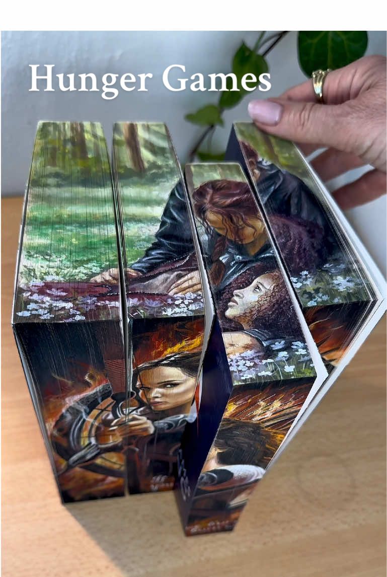 Did you see my hand painted Hunger Games book set? I take my inspiration from the famouse movies.  Katniss Everdeen Rue Lucy Gray #hungergames #BookTok #bookedgepainting #bookart #paintededges #художник #голодныеигры #искусство #книги #katnisseverdeen #lucygray 