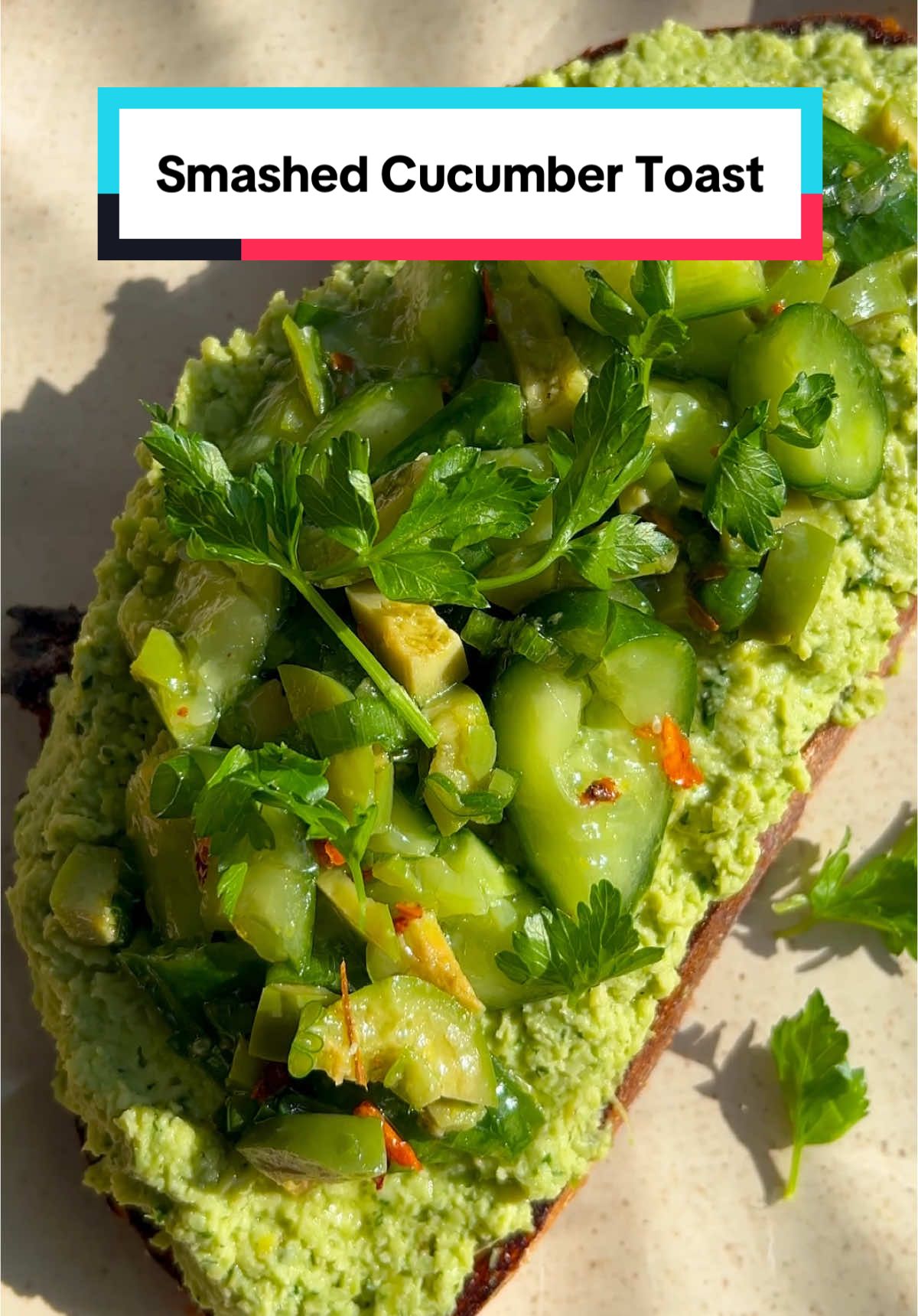 🥒 The breakfast I’ve been prepping lately. Smashed Cucumber Toast with Artichoke Edamame Spread. A good balance of all my favorite things (protein, fiber, veg). 😌 #breakfastidea #plantbasedrecipes Smashed Cucumbers 5 Persian cucumbers Kosher salt 1 clove garlic, grated Juice and zest of half a lemon 1/4 tsp red pepper flakes, optional 1 scallion, thinly sliced 2 tbsp Castelvetrano olives, diced 1 tbsp extra virgin olive oil Artichoke Edamame Spread 12 oz bag frozen edamame, thawed or cooked according to package instructions 1/3 cup jarred marinated artichoke hearts plus 3 tbsp of the artichoke marinade from the jar 3 tbsp Castelvetrano olives 1 scallion, roughly chopped 1 large clove garlic, grated Juice and zest of half a lemon 1/4 cup fresh parsley leaves plus extra for garnish 1/4 cup basil leaves 2–3 tbsp extra virgin olive oil 4 slices sourdough bread, for serving Flaky salt, for serving (optional) Full instructions and ingredient substitutions can be found on the blog. 