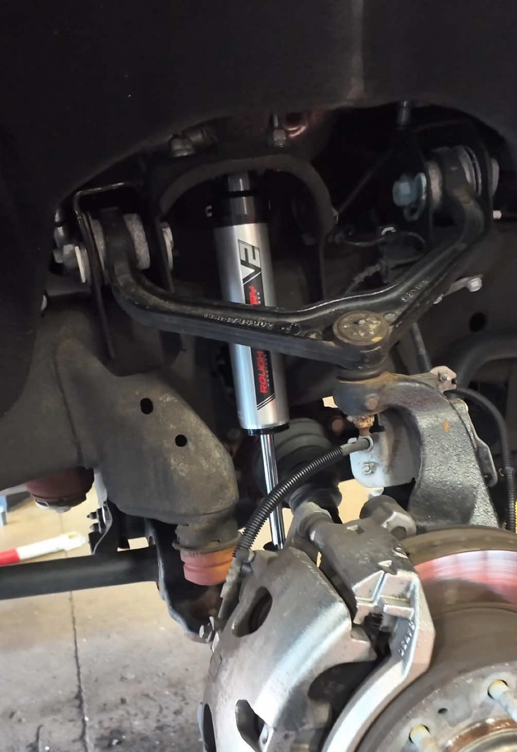 Swapped out those harsh factory shocks for the V2 Series shocks from @Rough Country!  Even with only 20k miles, the factory shocks had no rebound. They just stuck in whatever position they were compressed in. These V2 Nitrogen shocks not only improve ride quality and performance, they look good too 😎  #tiktok #rc #truck #denalihd #gm #gmc #lifted #fyp #fypシ #install #howto #DIY #shop