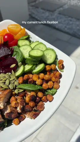 My current lunch fixation - so yummy & high protein / high fiber !!  Chickpeas: protein & complex carb / high in fiber so they’re slow digesting & controls blood sugar (and give it a crunch!)  Grilled chicken with marinade for protein (olive oil, garlic, apple cider vinegar, lime juice, salt, pepper & Dijon mustard!)  Veggies: Cucumbers  Tomatoes Peppers Pickled onion Pickled beet Broccoli sprouts  Pumpkin seeds for healthy fat - high in magnesium, omega 6 fatty acids, some protein + give it a crunch!  & tzatziki dip!! SO GOOD 