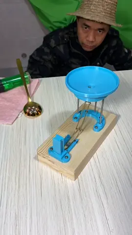 LINK IN BIO Witness the illusion of a perpetual motion machine! The ball rolls into a cleverly designed track, curving downward on wires and returning to the cone for another cycle. While it appears endless, a hidden battery powers the mechanism, giving the ball a gentle push to keep the motion alive. A fascinating blend of physics and engineering creativity! 