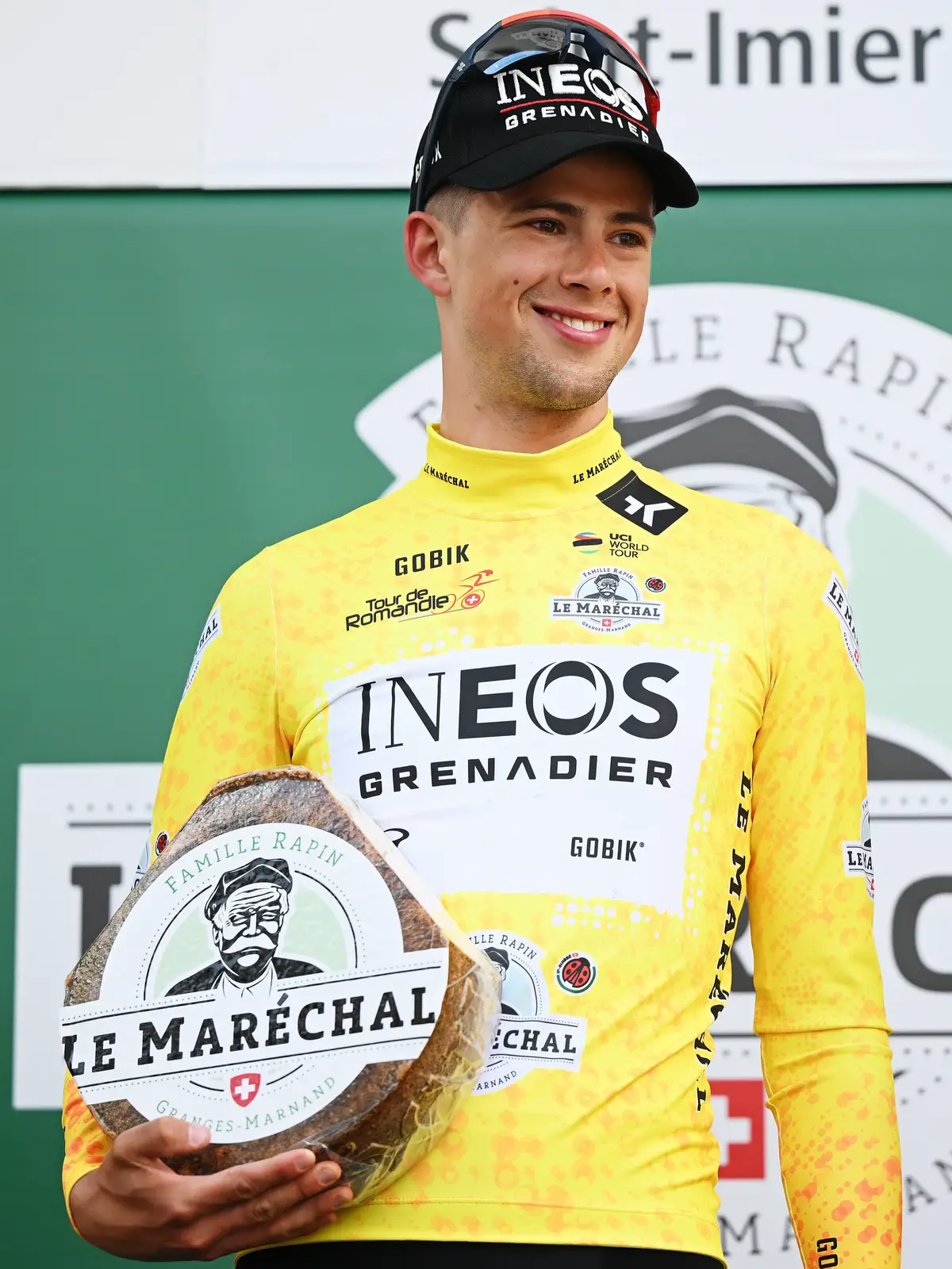 After winning the Prologue of the Tour de Romandie, Sam Watson picks up the leader’s jersey and receives a wheel of cheese 😆 #roadcycling #cycling