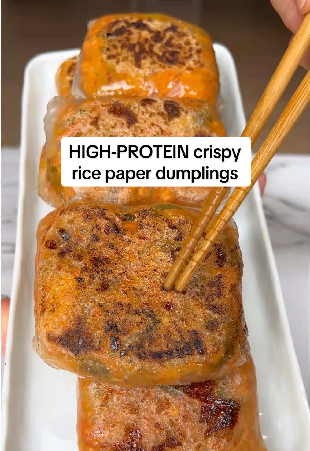 This. You need to try this. I’m not even exaggerating.  #Recipe Crispy Kimchi Rice Paper Dumplings 🥩 CHOOSE A PROTEIN ½ lb ground pork (my go-to) ½ lb ground beef for a richer flavor 1 can of tuna, drained ½ block extra firm tofu, crumbled 🍳 OTHER INGREDIENTS • 1 cup cabbage, chopped • ¼ cup shredded carrots • 1 cup kimchi, chopped  • 1 tbsp soy sauce • 1 tsp sesame oil • 1 tbsp gochujang (optional, for an extra bold kick and spice) • Black pepper • 2 green onions, thinly sliced • 1 egg, beaten • Rice paper sheets • Olive oil for cooking/pan-frying (I love the @Graza one) 👩🏻‍🍳 INSTRUCTIONS 1️⃣ In a pan over medium heat, add olive oil, cabbage, carrots, kimchi, & choice of protein 2️⃣ Add in soy sauce, sesame oil, gochujang, black pepper, and green onions. Cook until pork is fully cooked through. 3️⃣ Turn off heat and mix in the beaten egg (this will help bind everything together as the mixture cools slightly) 4️⃣ Soften a rice paper sheet in warm water, then lay flat. Add 2 big spoonfuls of filling to the center, fold in the sides, then roll like a spring roll. Double wrap with another spring roll. Repeat with remaining filling. 5️⃣ On a pan with some little olive oil, pan-fry the dumplings (seam-side down first), until crispy. • • • #sparkyspcosdiaries #pcosrecipes #highproteinmeals #lowcarbrecipes #highvolumefood #EasyRecipe #healthyliving #bloodsugarbalance #healthycomfortfood #koreanrecipes #kimchirecipe #ricepaperdumplings #crispydumplings #easthighprotein #mealprepideas #guthealthyrecipes #creatorsearchinsights 