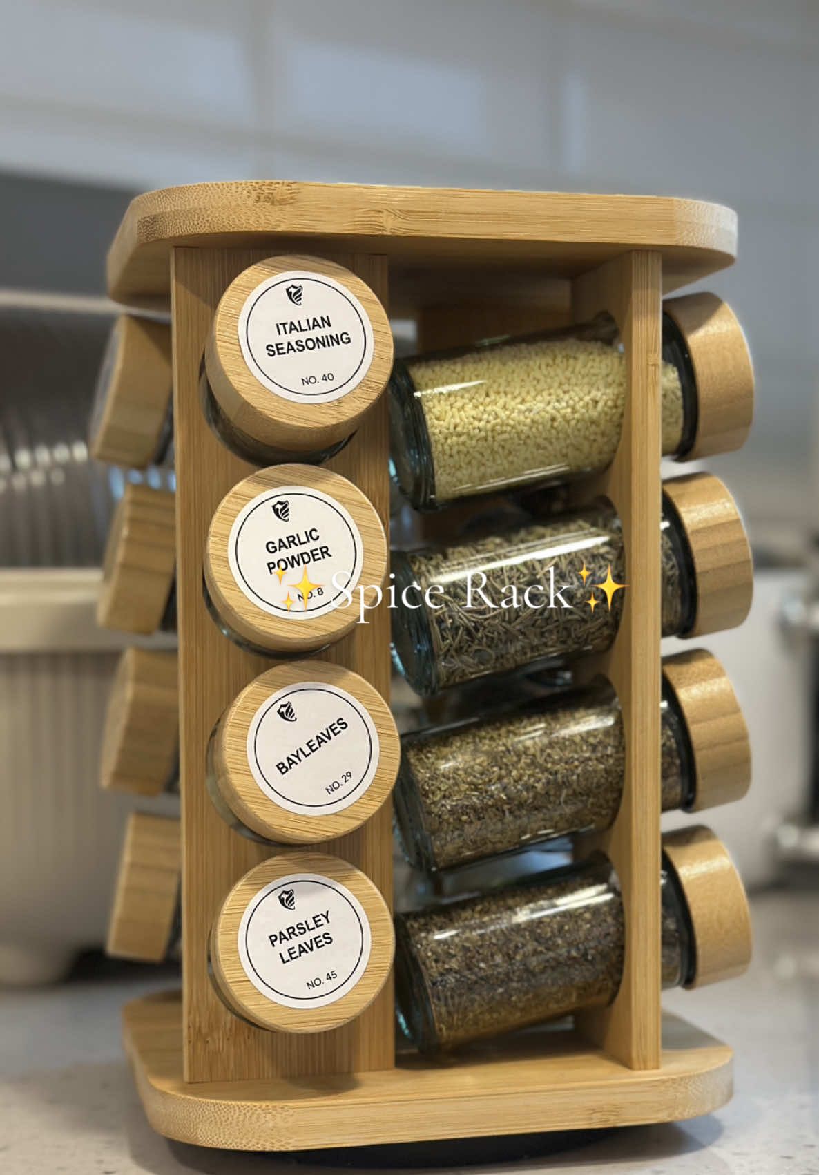 Rotating Spice Rack Organizer This Bamboo organizer is made of high quality solid wood, smooth and beautiful glossy finish, and exquisite craftsmanship. Environmentally friendly and lightweight! BASIL LEAVES BLACK PEPPER CHILI FLAKES GARLIC POWDER IODIZED SALT MAGIC SARAP OREGANO POWDER PAPRIKA POWDER PARSLEY LEAVES ROSEMARY LEAVES ITALIAN SEASONING BLACK PEPPER LEMON PEPPER