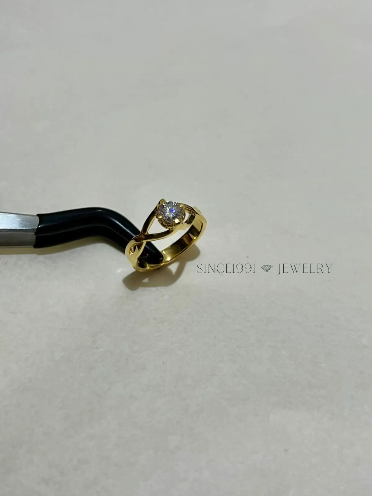 A graceful twist of simplicity. ✨ This solitaire ring stuns with its solid crisscross gold band and the brilliance of a 0.50ct center stone. Perfect for promises, proposals, or simply celebrating love. 💍 ~Crafting stories, in Gold #since1991jewelry CUSTOM MADE FINE JEWELRIES  ➡️ For a seamless experience with skilled jewelry artisans, please direct message us. IG: @since1991jewelry  FB: Since 1991  Whatsapp:  Specializing in traditional craftsmanship and the highest quality methods of jewelry making. 💯 ✨ ONLY REAL PAWNABLE GOLD (14K/18K/21K) 💎 Diamonds, Moissanite, and other gemstones (GRA IGI GIA) ⏰ Shorter production time with rush orders available. 📍 Meycauayan City, Bulacan  🌍 We ship anywhere in the Philippines and abroad. 💰 MOP: Cash on pick-up/Online transfer 💳 Installment/Layaway (30 days 0% interest) Money-back guaranteed if proven fake.   #fyp #engagementring #weddingring #pendants #rings #bracelets #memorabilia #handmadejewelry #customizedjewelry #gemstones #diamonds #moissanite #jewelrymaker #since1991jewelry #meycauayanjewelry #since1991 