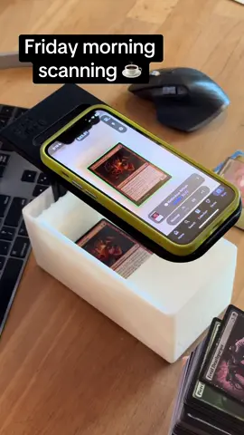 Nothing goes with coffee like scanning some magic cards ☕️ Get the all new and improved Card Slinger 5.0 today! Now with sliding drawer for easy card access, 9 color accents, and cute little feet! The Card Slinger is a first of its kind device to help you scan in un sleeved and sleeved MTG and TCG cards using scanning apps like ManaBox. Available for purchase on the tt shop or free 3d file download to print your own!  #cardslinger #manabox #scan #scanner #mtgscanner #3dprinted #mtg #magicthegathering #mtgcommunity #mtgcommander #mtgaddicts #mtgcards #magic #mtglife #tcg #mtgart #edh #mtgedh #mtgcollection #mtgcard #mtgdaily #magicthegatheringcards #wizardsofthecoast #wotc #mtgarena #commander #mtgaddict #mtgalter