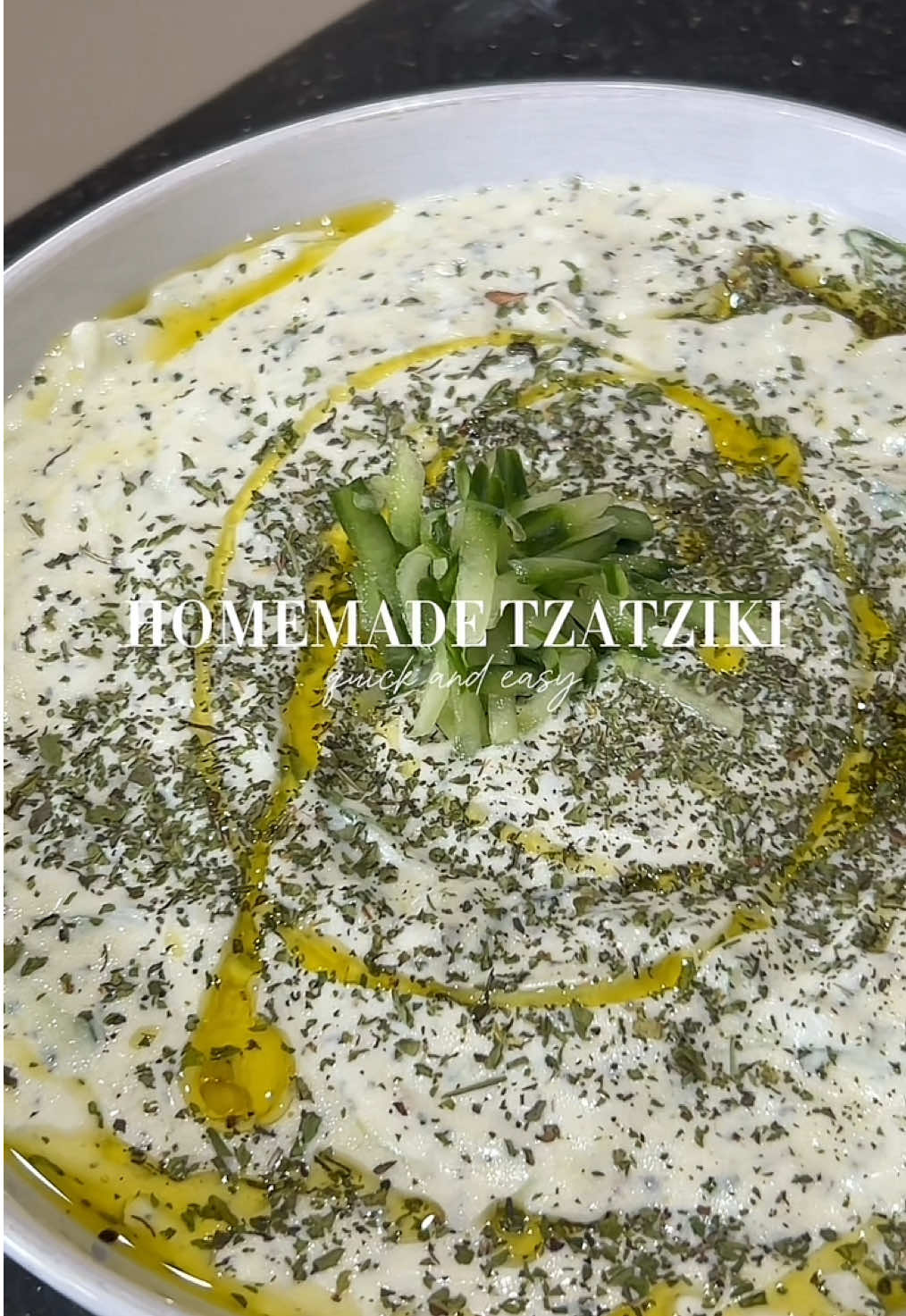 Quick and easy 3-minute Greek Tzatziki 🥒🇬🇷 Perfect as a side dish for those summer days! Ingredients:  Greek Yoghurt Grated cucumber  Ground black pepper  Mint  Olive oil Garlic/garlic paste Salt Garnish with mint and olive oil  #tzatziki #greektiktok #tzatzikisauce #tzatzikidip #greece #cyprus #cyprustiktok #greekfood #FoodTok #fyp #greekrecipe 