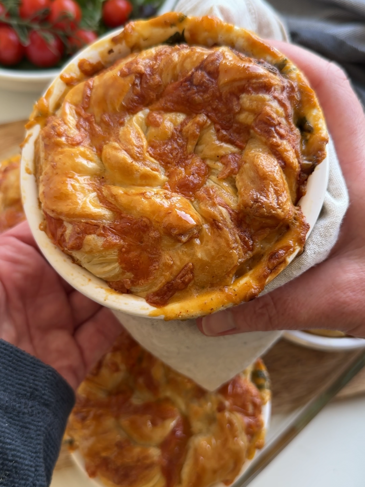 Cheese & Bacon Twist Pies Cheese twists remind me of when the kids were small. I used to make them a lot...so every crispy cheesy, flakey bite has always felt really nostalgic to me. So I decided to make smokey bacon and shallot pies and top them with golden, buttery cheese twists. I can't believe I never thought of doing this before. I'm honestly not exaggerating when I say that these are the most moreish, comforting pies that I've ever made. I'm 100% going to make these again - I'm thinking next time I'll do Cheese Twist Chicken & Leek Pies with roasties on the side... I've written up the recipe for these below and I would love to know what you think, A x Makes 4 individual pies 250g smoked bacon lardons 300g shallots finely sliced 1 tsp paprika 30g plain flour 500ml chicken stock 60g spinach 100g garlic and herb cream cheese Sheet of ready rolled puff pastry 100g grated cheddar cheese 1 egg beaten Heat a drizzle of oil in a large non-stick saucepan. Add the bacon lardons and shallots and fry on a medium for 5 minutes Stir in the paprika and flour on the heat until it's absorbed into the oil Slowly add the stock a little at a time. Stir continuously until it comes to the boil each time, before adding more liquid Stir in the spinach and soft cheese and season with black pepper (not salt as the bacon gives it enough) Divide between 4 small pie dishes Heat the oven to 190C (fan) Place the sheet of puff pastry on the worktop. Evenly spread grated cheese on one half of the pastry (lengthways) before folding the other half of the pastry over the top of the cheese. Press down gently. Cut the pastry lengthways into 4 equal strips.  Pick up one of the strips and twist the ends of the pastry in opposite directions until you have the desired twistiness! Turn the twisted length of pastry into a coil, leaving space between the turns so the pastry can puff up and carefully place it on the pie. Repeat with the rest of the pastry strips. *When cooking, the underneath of the pastry goes soft like suet, if you like it crisp all the way through, bake separately on a lined baking tray* Bake for 25 mins or until cooked through #recipes  #pie #comfortfood #DinnerIdeas  #bacon #homemade #foodmemories #bakingwithkids #delicious #sotasty #DinnerIdeas #roasties #goodfood #familyfood  #familydinner  #bakingideas 