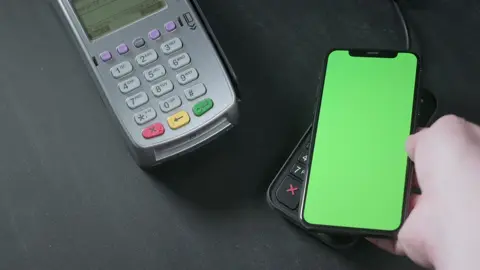 Green screen template on phone. Top view of a person using contactless payment with smartphone with green screen (EXCLUSIVE — COPYRIGHT FREE) #greenscreenvideo #copyrightfree #copyrightfree #posterminal #phonegreenscreen #contactlesspayment #contactlesspayments 