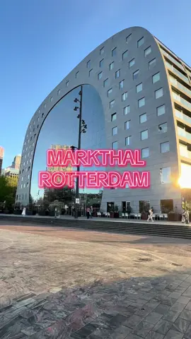 Markthal, located in the Blaak area of Rotterdam, is a unique architectural landmark and marketplace that combines food, culture, and community. Opened in 2014, it features a distinctive horseshoe shape and an impressive ceiling adorned with vibrant murals depicting fruits, vegetables, and other food-related themes.  Inside, visitors can find a diverse range of stalls offering fresh produce, gourmet foods, international cuisines, and artisanal products. The market is not only a place for shopping but also a social hub where people can gather to enjoy meals, attend events, and experience the local culture. Above the market stalls, there are also residential apartments, making it a mixed-use development that adds to the vibrancy of the area.  Markthal stands as a symbol of Rotterdam's innovative spirit and commitment to revitalizing urban spaces, making it a must-visit destination for both locals and tourists. #rotterdam #markthal #blaak #socalindo #echwel 