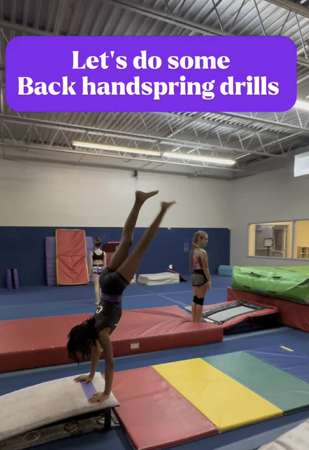 Do you know what each drill is for? 👇🏾 💜 Station 1 helps with:  • Power and timing from your snap-down to get momentum for the back handspring. • Shoulder and arm strength to push off fast and block correctly. 💜Station 2 helps with: • Generating  momentum. • Timing the arm swing and jump into the handspring. • Reinforcing body positions like a tight hollow and quick block. 💜 Station 3 helps with:  • Generating backwards momentum.  • Getting the timing right in the block • Connecting tumbling passes Let me know if you try any of these drills & which one is your fav!  #backhandspring #backhandspringtutorial #howtodo #gymnastics #tumbling 