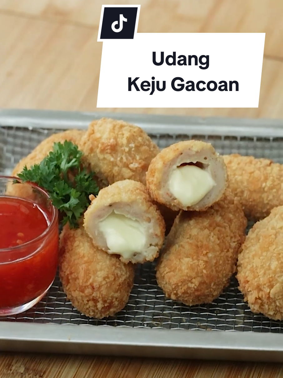 Resep Udang Keju (untuk 20 pcs) Bahan: 300 gr paha ayam filet 150 gr udang 2 siung bawang putih 15 gr tepung roti putih 1 sdt baking powder 1 sdm bawang merah goreng 1 sdm maizena 30 ml air 1 butir telur 1 sdt minyak wijen 2 sdm minyak 2 sdt saus tiram 1 ½ sdt garam 2 sdt gula pasir 1 ½ sdt kaldu ayam bubuk ¼ sdt merica Bahan isian: keju oles Bahan pelapis: pelapis basah tepung roti putih maizena Cara membuat: 1. Di dalam food chopper masukkan bawang putih, haluskan kemudian masukkan paha ayam filet, garam, gula pasir, kaldu ayam bubuk, saus tiram dan merica, aduk hingga lengket 2. Masukkan udang, tepung roti putih, maizena, baking powder, bawang merah goreng, air, telur, minyak wijen dan minyak, haluskan hingga rata. Diamkan di dalam kulkas 3. Balurkan keju ke dalam tepung maizena kemudian potong-potong dan balurkan kembali ke tepung maizena sambil dibentuk 4. Takar adonan dengan sendok es krim lalu balurkan ke dalam maizena. Isi dengan keju kemudian bentuk bulat memanjang 5. Balurkan udang keju ke dalam tepung basah lalu tepung roti, ratakan 6. Panaskan minyak, goreng udang keju di api sedang hingga sedikit kecokelatan, tiriskan 7. Untuk frozen food, kukus udang keju selama 10 menit di api kecil dalam keadaan tutup panci sedikit terbuka kemudian balurkan ke dalam tepung basah dan tepung roti 8. Udang keju siap disajikan