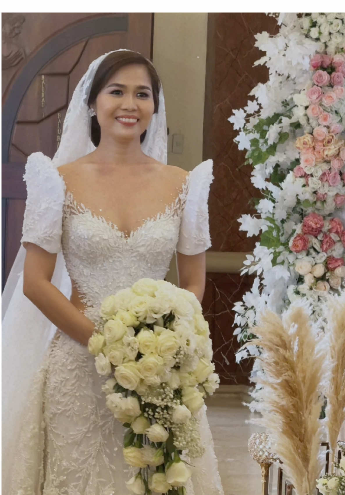 Our newlywed bride, Ms. Racel Ilagan, graced her special day in a captivating 2-way modern Filipiniana gown, featuring elegant sleeves and a customized side opening with skintone mesh for a subtle hint of allure. The dramatic overskirt and gown were lavishly embellished with iridescent beads, intricate embroidery, rhinestones, pearls, and Swarovski crystals. Her beautifully coordinated veil perfectly complemented the entire look, adding a final touch of elegance. 👰‍♀: @racel.ilagan 💄: @zhemakeup_artistry  💇‍♀️: @zhemakeup_artistry  📸: Nice Print Photography & Exige Weddings 📹: Niceprint Photography 👩🏻‍💻: @losfabulosos 🏩: Joselito’s Private Resort 💒 : St. John Marie Vianney Parish No copyright infringement intended, this music belongs to the rightful owner #bridesof2025 #brides  #bridesoftiktok #ReMarkablySophisticated #weddingdresses #bridestory #weddingtiktok #MarksBridesManila #trend #trendinggown #trendgowns #koreanwedding #koreandress #koreanlook #bridaldress #bridalgown #weddingdesigns #weddinginmanila #weddinginphilippines #weddingphotography #markbrides #weddingdesigner  #bride #weddingdress #bridal #bridetobe  #custommade #nocopyrightinfringementintendedmusicbelongstotherightfulowner 