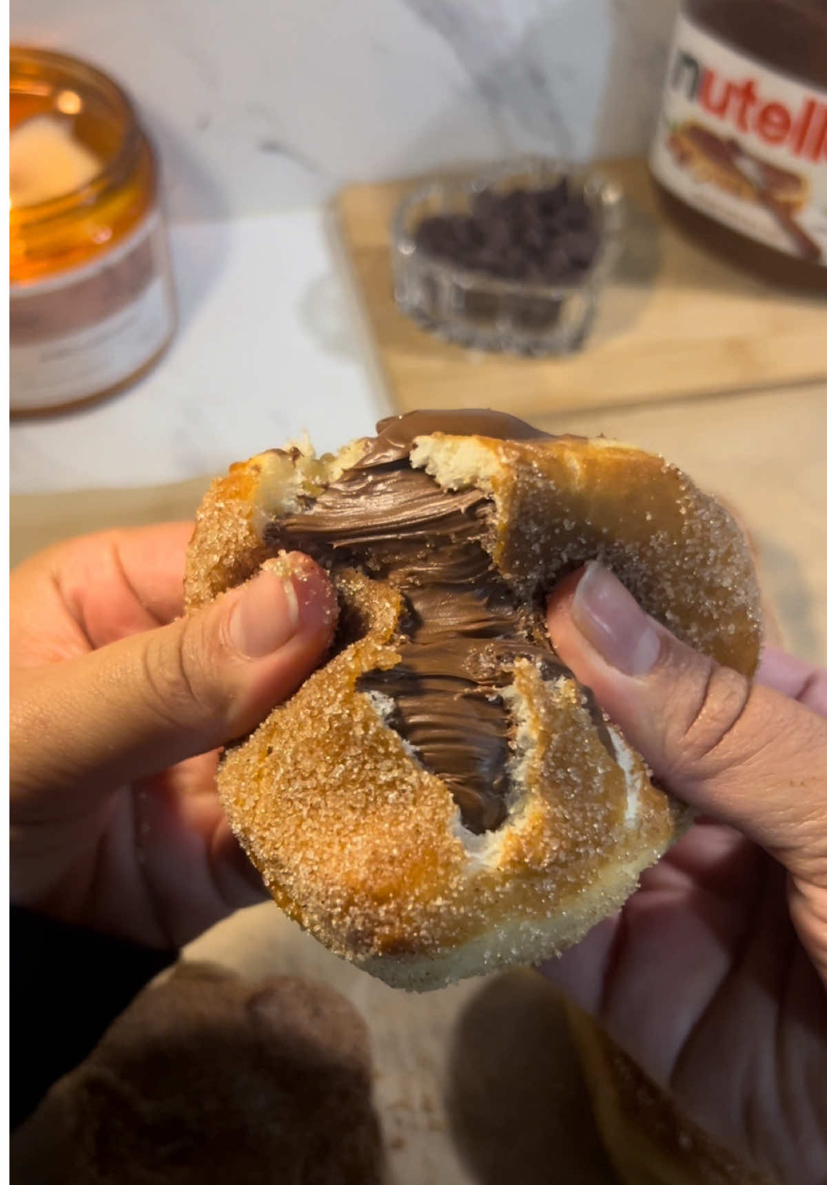 nutella donuts🍩🤎   recipe: 3/4 cup WARM milk(180ml) 1/4 cup of sugar (50g) 1 egg(room temp) 1/4 cup of butter(57g) (melted)  3 cups of flour (360g) 1 tsp salt (5.7g) 2 1/4 tsp of instant yeast(7g) 1/4 cup cinnamon & sugar mix(for topping) & nutella   mix your milk, sugar and yeast and set it aside for 5 minutes. then mix in your butter, egg & dry ingredients. knead until fully combined. set the dough in an oiled bowl for 1 hour covered to rise. after the hour roll out your dough and shape! ( let rise for about another 30 minutes to achieve the fluffy donut look) then fry until golden brown on each side, top with cinnamon sugar and stuff with nutella (or don’t!)      #nutelladonuts #nutella #donut #baking #Recipe #fyp 