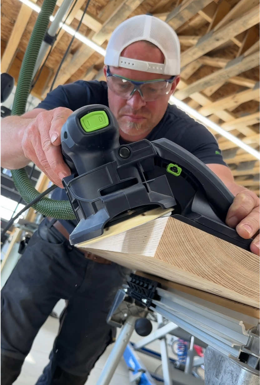 Sanding down the countertop edge at 45 degrees with the @Festool Canada ETSC 125 sander and edge sanding guide