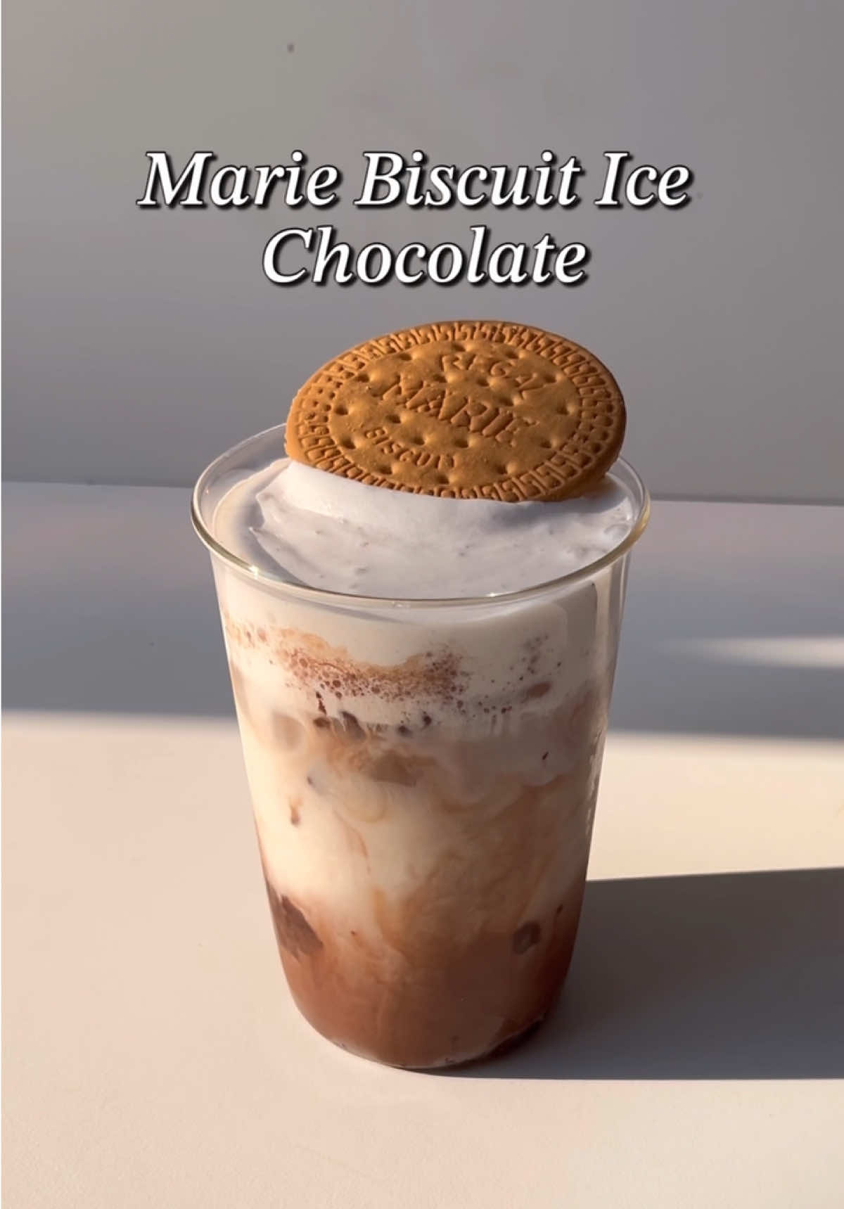 Marie Biscuit Ice Chocolate🤎 Bahan - bahan / Ingredients: 2-3 marie biscuits 100 ml susu / milk 2-3 sdt (tsp) cocoa powder 1 sdm (tbsp) susu kental manis / condensed milk 40 ml air panas / hot water Cream Marie biscuit Ices #homecafe #homecafeindonesia #Recipe #aesthetic #chocolate #EasyRecipe #icechocolate #fyp