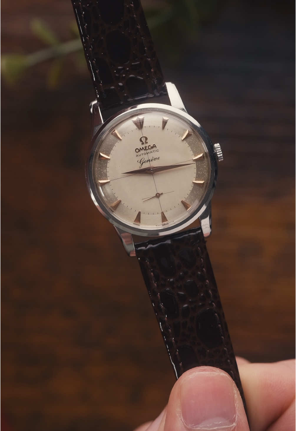 Vintage elegance. Simply stunning… this watch is available now on our website and here are the details: Year: 1962. Movement: Automatic Omega 491 movement. Case and Crown: 35mm steel case. Original Crown Dial: Silver “raised” crosshair dial with applied Omega  logo. Rose gold hands and details. Crystal: Acrylic crystal. Strap: Brown leather strap. As with all watches bought from Watts On Watches, this watch comes with a 12 month warranty. #omega #vintageomega #watches #watchdealer #fyp 