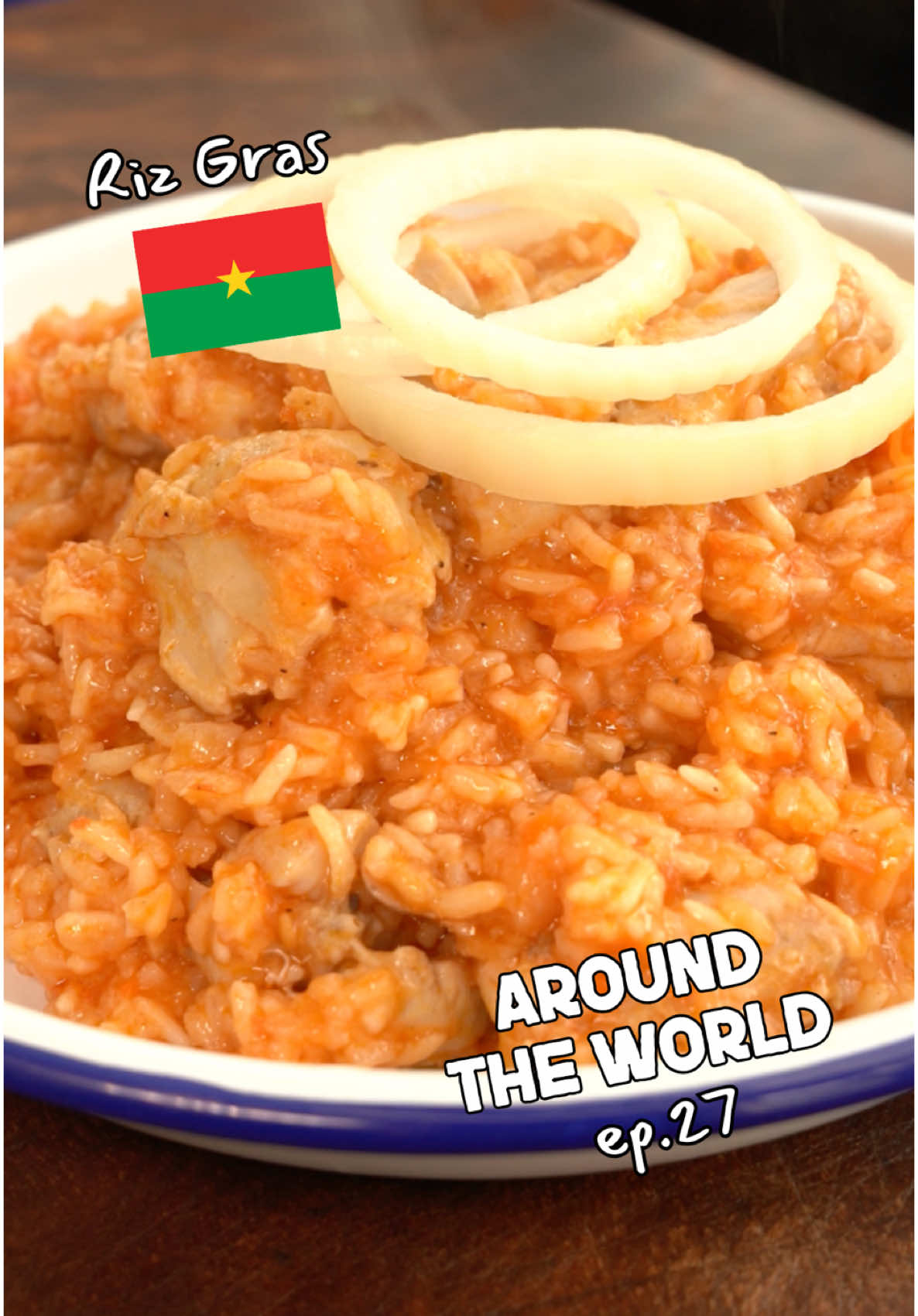 Riz Gras – Burkina Faso 🇧🇫 – Around the World – Episode 27 I’m attempting to cook a dish from EVERY single country in the world in alphabetical order. Today, we’re in Burkina Faso making Riz Gras – a rich, tomato-based rice dish full of depth. Ingredients (Serves 4): 500g long grain rice, washed 9 skinless chicken thighs 1 onion (for blending) 5 garlic cloves 5 large tomatoes 1 scotch bonnet (deseeded if preferred) 2 tbsp tomato purée 3 Maggie stock cubes 500ml hot water ½ cup vegetable oil Salt and black pepper, to season 1 onion, thinly sliced into rings (for garnish) Method: Blend the onion, garlic, tomatoes, and scotch bonnet until smooth. Heat the vegetable oil over medium heat. Pour in the blended tomato mixture and fry for 10–15 minutes until reduced, darkened in colour, and the oil begins to separate. Stir in the tomato purée and cook for a few more minutes until thick and rich. Pour a little water into the blender to collect the residue, give it a quick blend, and pour this into a large pot. Add the chicken thighs, season with salt and pepper, and simmer gently until the chicken is fully cooked through. Add the cooked chicken to the sauce and stir through. Dissolve the Maggie cubes in 500ml hot water and pour this into the pan. Let it simmer for 10 minutes so the flavours come together. Stir in the washed rice, ensuring it’s evenly coated and submerged in the liquid. Nestle the chicken back on top, cover with a lid, reduce the heat to low, and cook for 20–25 minutes until the rice is tender and all the liquid has been absorbed. Fluff the rice gently and top with the cooked chicken. Garnish with raw onion rings for a fresh crunch. Enjoy! #aroundtheworld #worldfood #burkinafaso #rizgras #AfricanFood #series 