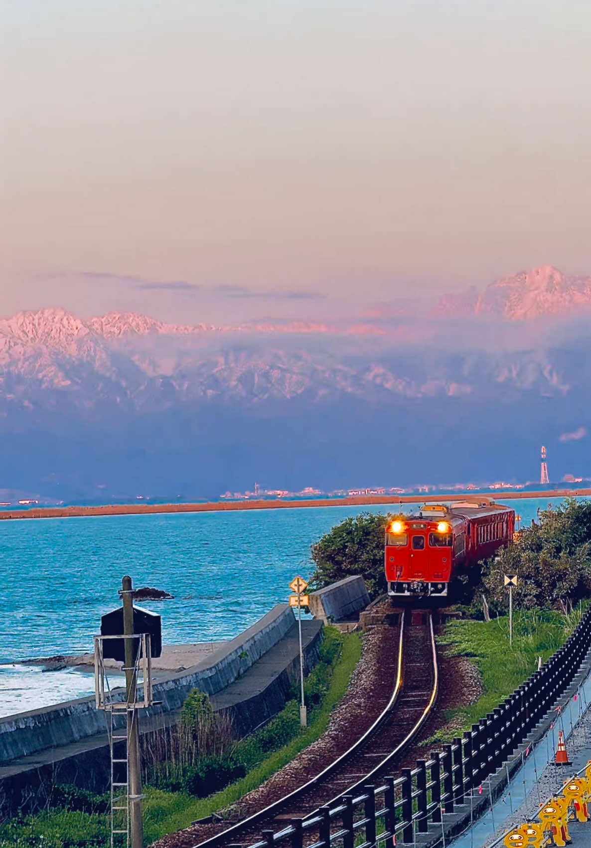 Snowy mountains in the distance, a train by the coast, and the calm of Amaharashi Beach unreal views that feel like a painting. Amaharashi Beach, Toyama Prefecture 📍 #relaxingvideos #traveltiktok #vactionmode #日本 #frypgシ #fry #TravelTok #AmaharashiBeach #JapanViews #MountainMagic #SeasideSerenity #japan #japan #japantravel #japanntrip #anime #japangram #amaharashi #amaharashicoast #toyamaprefecture #toyama #toyamatrip #toyamajapan #snow #traveljapan #tripjapan #japan #visitjapan #雨晴海岸 #水見線 #富山#富山旅行 #富山県 #富山観光 #雪景色 #雪 #日本の風景 