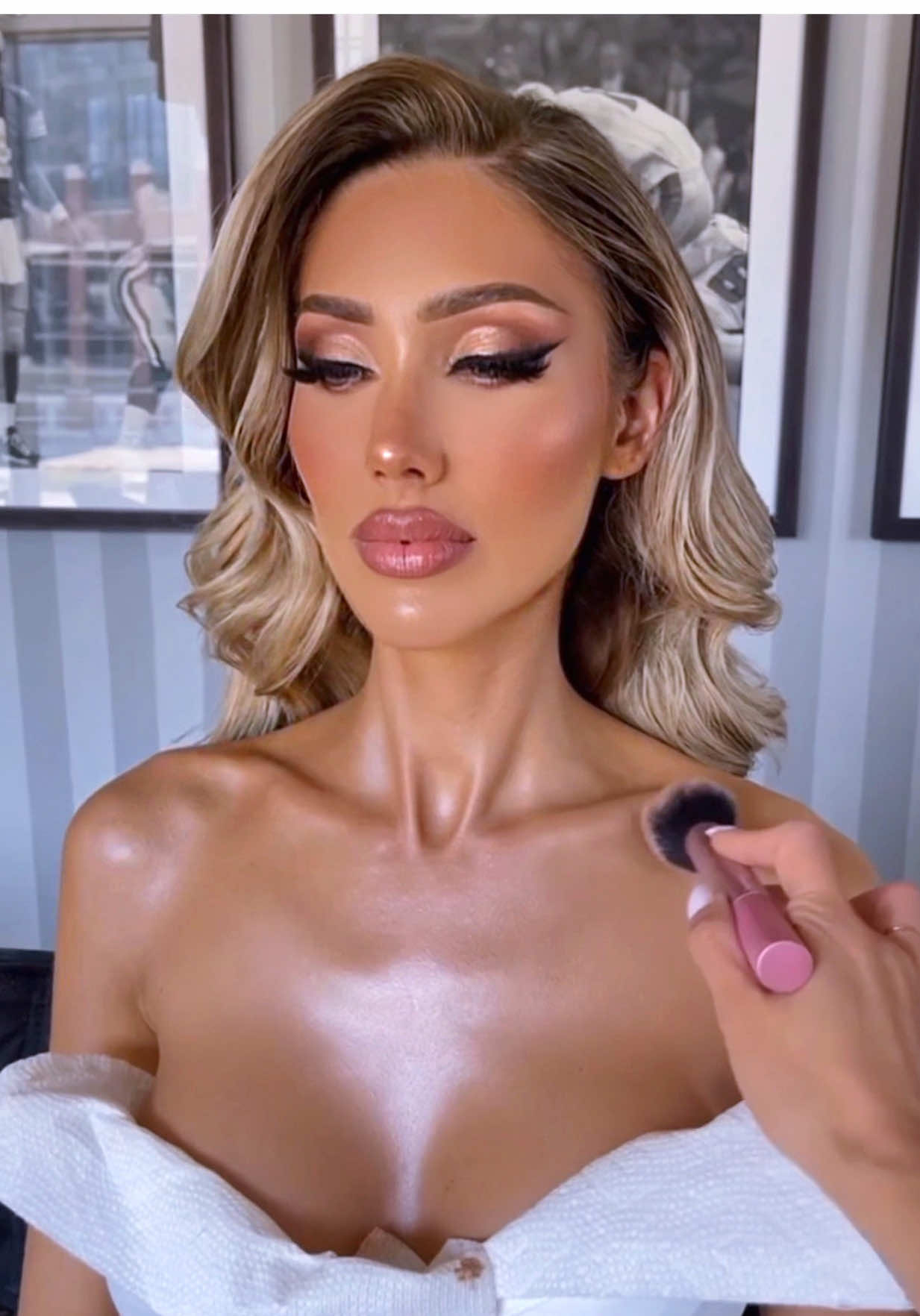 THE ULTIMATE BODY GLOW RECIPE Because your face isn’t the only thing that deserves to shine… Here’s my step-by-step routine to achieve that luminous, candlelit glow on your chest, neck, and shoulders — perfect for photos, events, or just feeling divine: 1. Start with hydration Generously mist your skin with rose water — think of it as a pre-glow shower. It softens the skin and preps it for everything that follows. Or use any body lotion.  2. Liquid radiance base Apply a layer of @elfcosmetics Halo Glow or @Charlotte Tilbury Hollywood Flawless Filter all over your chest, neck, and shoulders. This is your glowy canvas. 3. Lock it in Spray a generous layer of @milkmakeup Hydro Grip Setting Spray to grip and layer the glow products like a dream. 4. Liquid gold Apply @coverfx Custom Enhancer Drops (hello, glow!) and blend them in seamlessly over the same areas. 5. Seal + stack Spray another fine mist of @Milk Hydro Grip to melt the layers together and give a second-skin finish. 6. Bring the sparkle Dust on a dry loose highlighter by @Artist Couture — this adds that soft, sparkly veil of light. 7. Spotlight moment Tap @ColourPop Cosmetics “Flexitarian” highlighter directly onto your collarbones for that high-voltage shimmer. 8. Final set Lock it all in with @ONE SIZE BEAUTY etting Spray — so your glow doesn’t move, crease, or sweat away.  #bodyglow #bodyoil #bridalglow #skinglow #glowingskin #flawless #bridalmakeup #bridalmakeupartist #weddingtiktok #bridetobe #bridal #chicagomakeupartist #GlowUp #wedding 