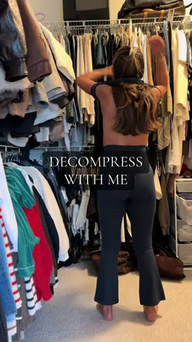 Decompress with me from the day. How do you decompress?  @onequince activewear set, @Athletic Propulsion Labs sneakers, @Aritzia pullover, @apple headphones, @ARMRA colostrum, @Simple Modern water jug, @Peach & Lily lip balm, @hanes socks 