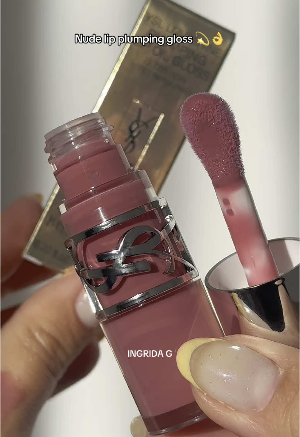 The most perfect nude lip plumping lip gloss 💫  @YSL Beauty Yves Saint Laurent Loveshine Plumping Lip Oil Gloss Nude - 44  @LOOKFANTASTIC code LFTFINGRIDAG for money off  👛Locking in up to eight hours of glass-like shine, the Yves Saint Laurent Loveshine Plumping Lip Oil treats lips to plumping hydration with a sheer swipe of pigment. 👛Infused with hyaluronic acid and fig, the formula lends up to 24 hours of moisture to encourage a smooth, supple finish.  👛Ginger and pepper oils provide a subtle tingling sensation upon application, promoting a juicier appearance, while its non-sticky consistency supports comfortable and nourishing wear.  👛This lip oil glides on seamlessly thanks to the brand’s full, fluffy doe-foot applicator that contours to your lips curves. Please do not use/repost my content without my permission  🏷️ purple lip gloss unboxing asmr nature sounds #ysl #yslbeauty #lipgloss #asmr #lipoil #purplelip #lipplumper #lipplumping #glitter #glitterlipgloss #lipstick #naturesounds #mauvelips #mauve 