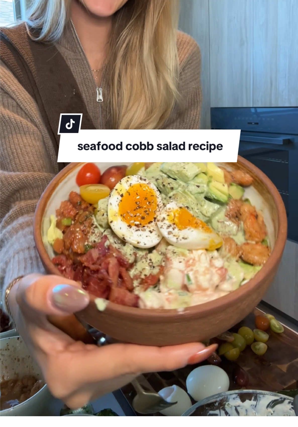 the best salad you will ever eat omg— seafood cobb salad inspired by the four seasons Maui 🌺🦞 #saladrecipe #salad #cobbsalad #seafood #summerdinner #summerrecipes  Ingredients For the salad 4 cups butter lettuce, gently torn ½ cup caramelized sweet onion (see method below) 1 cup baby tomatoes, chopped 1 avocado, sliced ½ cup white wine soy-butter shrimp (see method below) ½ cup lobster salad (see method below) 2 large eggs ½ cup marinated sushi-grade ahi tuna (see method below) 4 slices smoked maple bacon, cooked and chopped For the Green Goddess Ranch Dressing ⅓ cup mayonnaise ⅓ cup sour cream or Greek yogurt 2 tablespoons milk, buttermilk or water 1 tablespoon lemon juice 1 tablespoon chopped parsley 1 tablespoon chopped basil 1 tablespoon chopped chives 1 garlic clove, minced salt and freshly ground black pepper, to taste Instructions 1. Make the dressing Combine mayonnaise, sour cream, buttermilk, lemon juice, olive oil, herbs, and garlic in a blender or food processor. Blend until smooth and creamy. Season with salt and pepper to taste and chill until ready to use. 2. Caramelize the onions In a skillet over medium-low heat, melt 1 tablespoon butter with 1 teaspoon olive oil. Add 1 large sweet onion, thinly sliced, and a pinch of salt. Cook slowly, stirring occasionally, for 25 to 30 minutes until deeply golden and tender. Set aside to cool. 3, Boil the eggs Bring a pot of water to a boil. Gently lower in the eggs and boil for exactly 6 minutes. Transfer to an ice bath and chill completely before peeling. Slice in half before serving. 4, Cook the shrimp In a skillet, melt 1 tablespoon butter over medium heat. Add 8 peeled and deveined shrimp. Pour in 2 tablespoons white wine and 1 tablespoon soy sauce. Cook for 2 to 3 minutes, until shrimp are pink and just cooked through. Let cool. 5, Prepare the lobster salad In a small bowl, mix together ½ cup cooked lobster meat (chopped), 2 tablespoons mayonnaise, 1 teaspoon Dijon mustard, 1 teaspoon lemon juice, and 1 tablespoon finely chopped chives. Season with salt and pepper to taste and chill. 6. Marinate the ahi tuna In a small bowl, combine ½ cup sushi-grade ahi tuna (cubed) with 1 teaspoon soy sauce, 1 teaspoon sesame oil, and ½ teaspoon rice vinegar. Let marinate for 10 to 15 minutes, then drain slightly before serving. 7. Assemble the salad Arrange the butter lettuce on a large platter or individual plates. Top with caramelized onion, chopped tomatoes, avocado slices, shrimp, lobster salad, marinated ahi, halved jammy eggs, and chopped bacon. Drizzle generously with the Green Goddess Ranch dressing or serve it on the side.