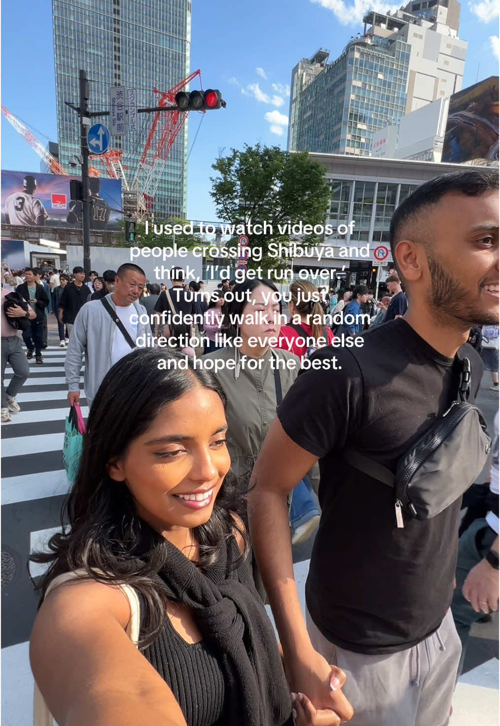 Shibuya Crossing: where 3,000 people walk in different directions and somehow no one dies. 10/10 would recommend. 🫶🏾✨ #shibuyacrossing #tokyo #browngirltravels #browncouple 