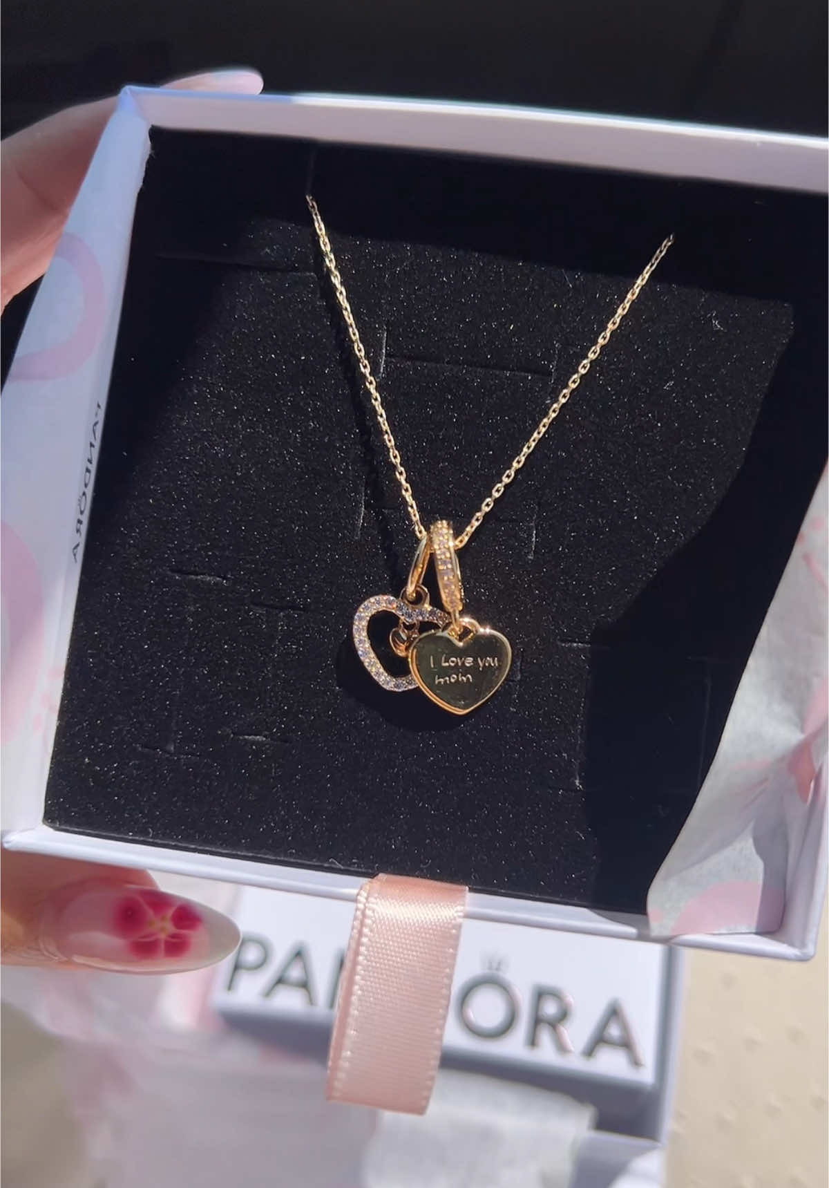 Very special gift from my daughter 🥹 it says “I love you mom” 😭 Happy Mother’s Day to all the moms!! 💘 #mothersday #mothersdaygift  #custommadepandora #pandora #pandoranecklace 