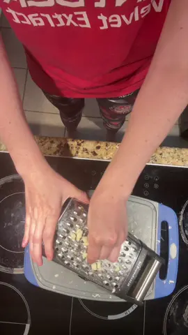 Rubbing the cheese grater like a genie 