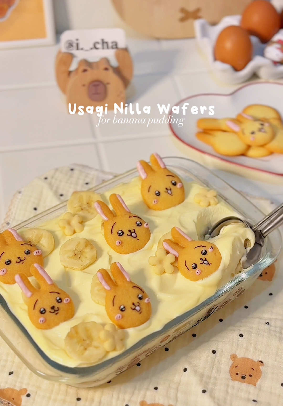 this is how i make my homemade usagi-shaped nilla wafers that i used in my banana pudding 🌝👍 📝ingredients: 200g all purpose flour 130g powdered sugar 120g unsalted butter (room temp) 1/2sdt salt 1sdt baking powder 1sdt vanilla extract 1 egg 60ml whole milk decoration: melted dark chocolate melted white chocolate with food colouring steps: 1. mix butter, vanilla extract, powdered sugar & salt with hand mixer until well combined (± 1-2 mins) 2. add in the egg and milk, mix them again. lastly, sift in the flour and baking powder. mix again in low speed until mixed thoroughly. 3. put the mixture in a piping bag, & squeeze it on top of baking pan like shown in the video 4. bake in 150-160C for 20mins (depends on your oven, if the texture is too soft, bake it again for 5mins) — @i._.cha  ❕please do not repost my videos without permission.  #homecafe #homecafé #homecooking #homebaking #homebaker #pudding #bakeathome #cutefood #chiikawa #bananapudding