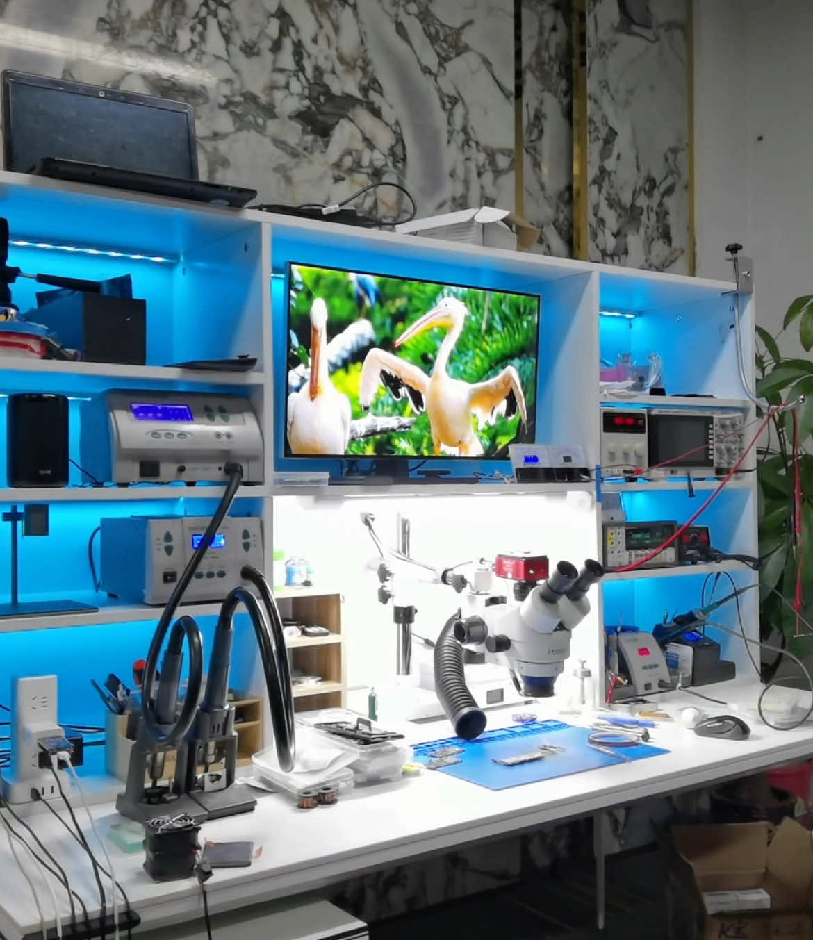 This is a smart repair workstation I built in 2021. It can control all connected devices remotely or via voice commands and is equipped with RGB ambient lighting. Now, in 2025, I’m planning to build an even smarter and cooler workstation. Every repair technician dreams of having their own customized setup, and I’d love to hear your valuable suggestions. Thank you! #iphonerepair #rabbitfix #phonerepair #repair 