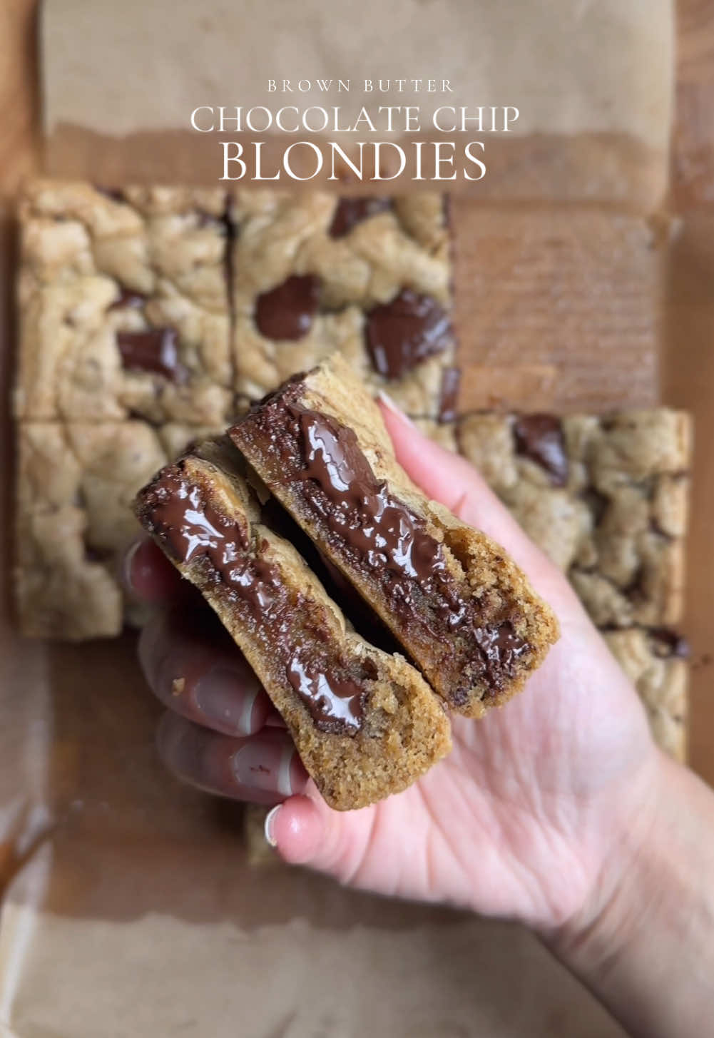 Brown Butter chocolate chip blondies. Ingredients: - 1/2 cup (115g) unsalted butter, melted and cooled - 2 tbsp neutral oil (avocado oil works well) - 1/2 cup (100g) light brown sugar - 1/3 cup (67g) granulated sugar - 1 large egg, room temperature - 1 tbsp vanilla extract - 1 1/4 cups (185g) all-purpose flour, spooned and leveled - 1/2 tsp baking soda - 1/2 tsp flaky sea salt - 1 1/2 cups semi-sweet chocolate For garnish:   - Flaky sea salt Method: 1. Preheat oven to 350°F (175°C). 2. In a medium saucepan over medium heat, melt the butter. Once boiling, swirl the pan or stir constantly until the butter turns a deep amber color (brown butter). 3. In a bowl, whisk together flour, baking soda, and salt. Set aside. 4. In a separate bowl, combine cooled brown butter, oil, brown sugar, and granulated sugar. Whisk 1-2 minutes until a smooth paste forms. 5. Crack in the egg and add vanilla extract. Mix until well combined and the mixture turns into a smooth paste (2-3 minutes). 6. Combine dry ingredients into the wet batter and gently fold until just combined. 7. Add chocolate and mix with a spatula until evenly distributed. Avoid overmixing. 8. Line an 8x8-inch baking pan with parchment paper. 9. Press the batter into the prepared pan. 10. Bake for 25-30 minutes or until lightly golden. 11. Remove from oven and sprinkle with flaky sea salt. 12. Allow to cool completely in the pan before serving. Tips: - Ensure the brown butter cools slightly before mixing with other ingredients. - Don't overmix the batter. - Keep an eye on the oven to avoid overbaking. #chocolatechip #blondies #bake #Recipe #cookiedough #cookie #brownbutter #Recipe 