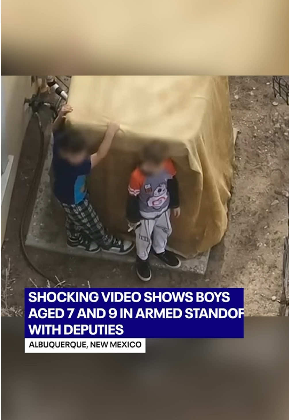 Shocking video showed two boys, aged 7 and 9, armed with a loaded firearm in a standoff with law enforcement in Albuquerque, New Mexico. Drone footage showed the two boys dressed in Minecraft and Star Wars-themed clothing as they stood behind a covered unit. The handgun was clearly visible in their hands, and they passed the weapon between one another. According to The Albuquerque Journal, deputies fired a less-lethal round to distract the boys, and one of the kids raised the gun and pulled the trigger. Sheriff John Allen told the outlet that the gun malfunctioned but had it gone off, 