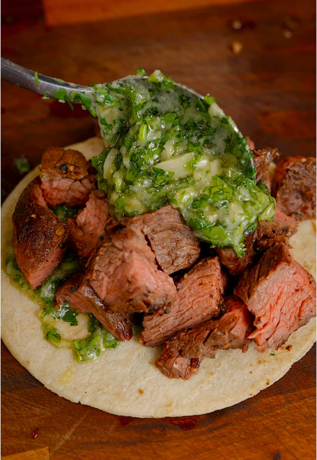 🇪🇸 Cuando la carne está en oferta en @sedanossupermarket se hacen tacos. 🇺🇸 When steak goes on sale @Sedano’s Supermarket we make tacos. - Vacío // Flap Meat 1. Sazona con tu sazonador de preferencia o solo con sal y pimienta // Season with your seasoner of choice or simply with salt and pepper.  2. Cocina a la plancha o a la parrilla // Cook on a plancha or grill. Chimichurri de Ajo Rostizado // Roasted Garlic Chimichurri: - 6 Cabezas de Ajo // 6 Garlic Heads - Aceite de Oliva // Olive Oil - Sal // Salt - Cilantro - Limon // Lime  1. Hornea el ajo con sal y aceite por 45 minutos a 400°F/200°C // Bake the garlic with salt and oil for 45 minutes at 400°F/200°C. 2. Combina el ajo rostizado con el resto de los ingredientes // Combine the roasted garlic with the rest of the ingredients. Salsa Roja // Red Salsa: - 5 Tomates // 5 Tomatoes - 1 Cebolla // 1 Onion - 2 Jalapenos - 8 Dientes Ajo // 8 garlic Cloves - 5 Guajillos  - 1 Chile de Arbol - Aceite // Oil 1. Cocina todos los ingredientes en una sartén hasta asar // Cook all ingredients in a pan until roasted. 2. Licua los vegetales junto a Sal, Jugo de Limón, Cilantro y una taza de agua // Blend the vegetables with salt, lemon juice, cilantro and a cup of water. #andrescooking #sedanos #tacos #carneasada #fyp 