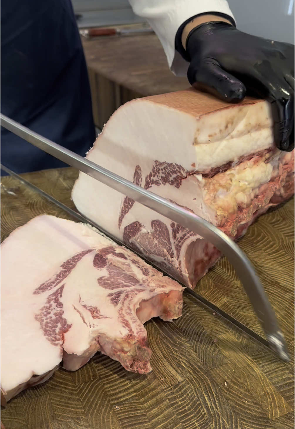 Breaking down some serious Iberico pork chops. That fat cap says it all...⁠ ⁠ #iberico #ibericopork #marbling #porkfat #pork #butcher #butchershop #porkchop 