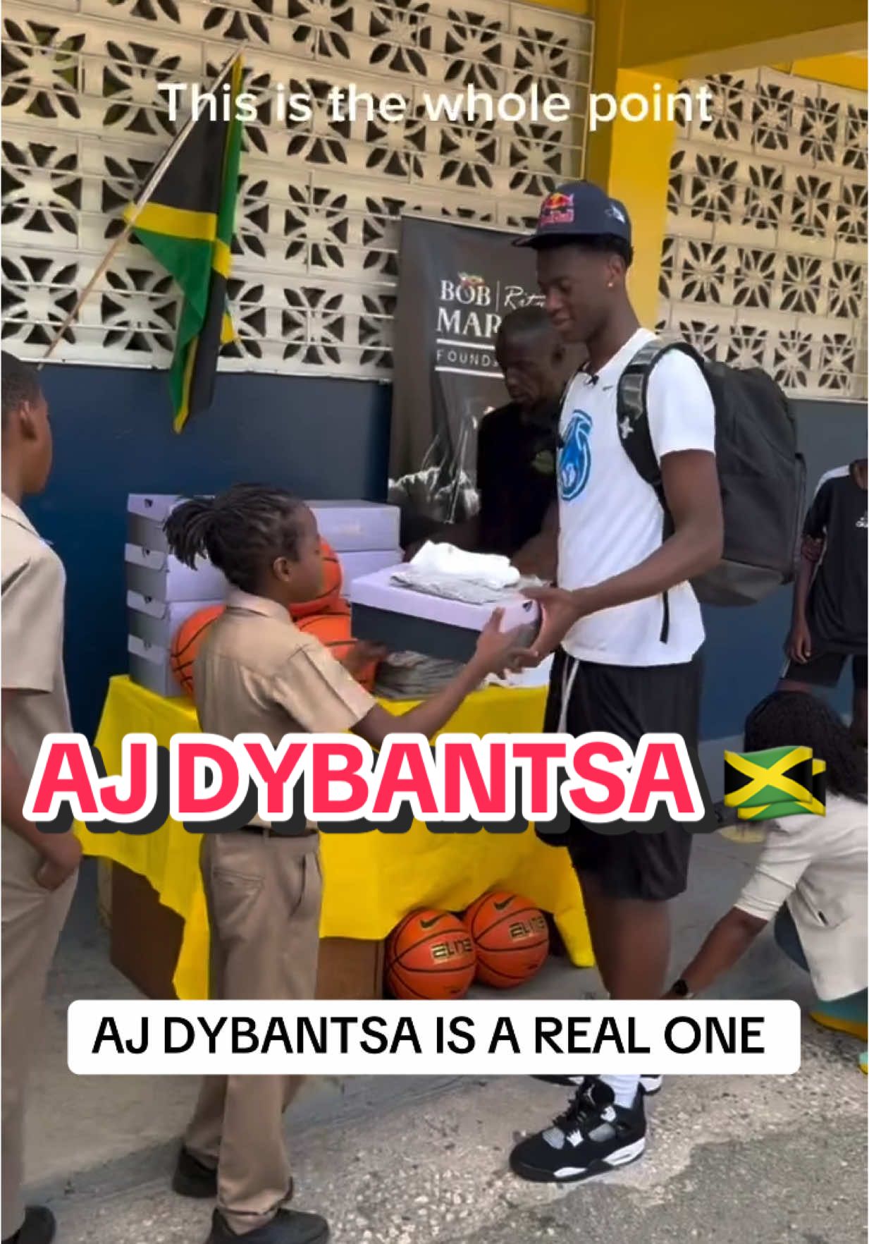 AJ Dybantsa pulled up to Jamaica and blessed the kids with free shoes 🥹 @ajdybantsa #sneakers #nike #fashion #NBA #basketball #byu #shoes #hypebeast #jamaica #island 
