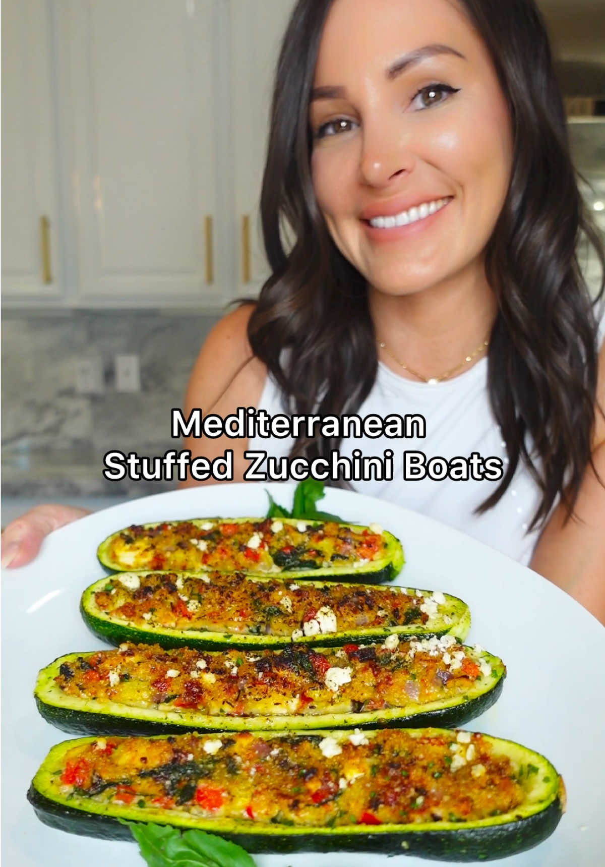 Weeknight dinner just got a Mediterranean makeover! These easy stuffed zucchini boats are loaded with sun-dried tomatoes, feta, spinach, olives, and herbs for a nutritious, flavor-packed meal the whole family will love! Mediterranean Stuffed Zucchini Boats Serves 4 Ingredients: 4 zucchinis 1/2 red onion, diced 1 red bell pepper 1 tsp oregano  2 garlic cloves, minced 3 cups baby spinach, torn into bite size 1/2 cup jarred sun dried tomatoes, chopped 1 cup crumbled feta, + more for garnish 1 cup seasoned breadcrumbs + 1/4 cup topping 1/3 cup Kalamata olives, chopped 3 eggs Olive oil Salt and Pepper TT Parsley for garnish (optional) Directions: Slice zucchini in half lengthwise then use a spoon to carefully scoop out the center (reserve). Chop reserved zucchini flesh into bite-size pieces then sauté in 1 tbsp olive oil along with diced red onion and red bell peppers until softened and all moisture has evaporated (about 5 minutes).  Add oregano, fresh garlic and baby spinach and cook until fragrant (about 1 minute longer). Season with salt and pepper to taste.  Add to a bowl along with sun-dried tomatoes feta, breadcrumbs and kalamata olives.  Whisk eggs then add to the mixture.  Spray, both sides of your zucchini boats with olive oil, season then fill with your stuffing. Top with more breadcrumbs, spray with olive oil then bake in a 400° oven for 20 minutes. Garnish with more feta and fresh parsley. Enjoy! #ZucchiniBoats #EasyDinnerIdeas #HealthyRecipes #WeeknightDinner #MediterraneanEats
