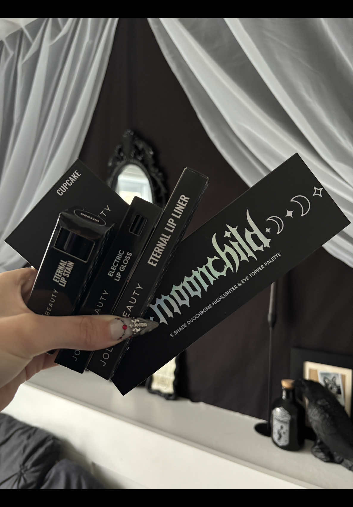 Unboxing Jolie Beauty’s package!🦇🕷️🕸️🐈‍⬛ @Jolie Beauty  IN LOVE with their products, these are absolutely GORGEOUS and I am obsessed with the moonchild and tainted palette! A must! #goth #makeup #gothmakeup #fyp #gothgirl #vampire #vampiremakeup #witchmakeup #unboxingvideo #makeupunboxing 