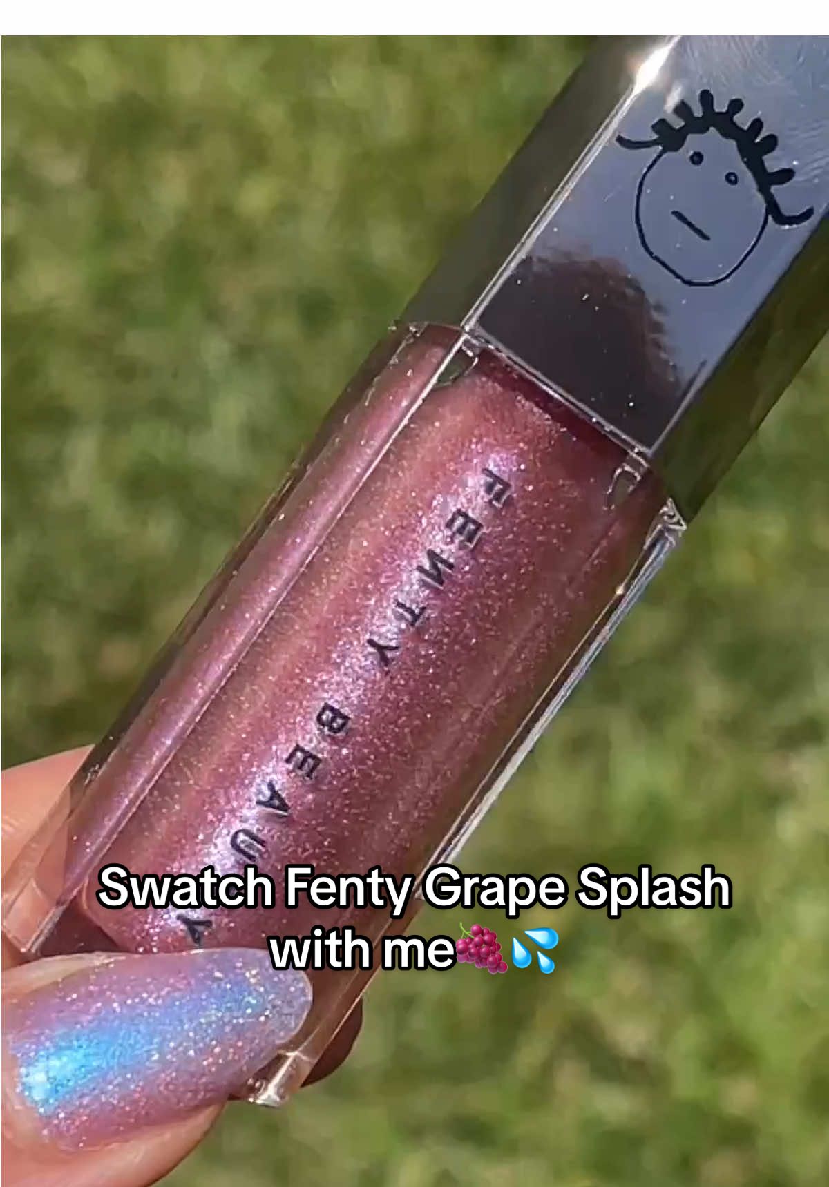 💋🍇SWATCH @fentybeauty Limited Edition Grape Splash Gloss Bomb 💣 💋 I thought I was done buying glosses for a while… til Fenty teased this multichrome glittery gloss bomb Grape Splash!  🍇it was available at their pop up shop experience in NYC, and then then released it on the @shopapp for a limited time… so of course I bought more than one of them 🥹😂🤭😬::: I’m a SUCKER for a limited edition shade - and she’s gorgeous.  🍇grape splash has a semi sheer lavender pinky base with multicolored glitter - so blue, pink, lavender, and it makes your lips look sooooo juicy.  I’ve seen some gorgeous lip combos using darker liner, so I will be doing that for sure!  🍇did you grab one?! 