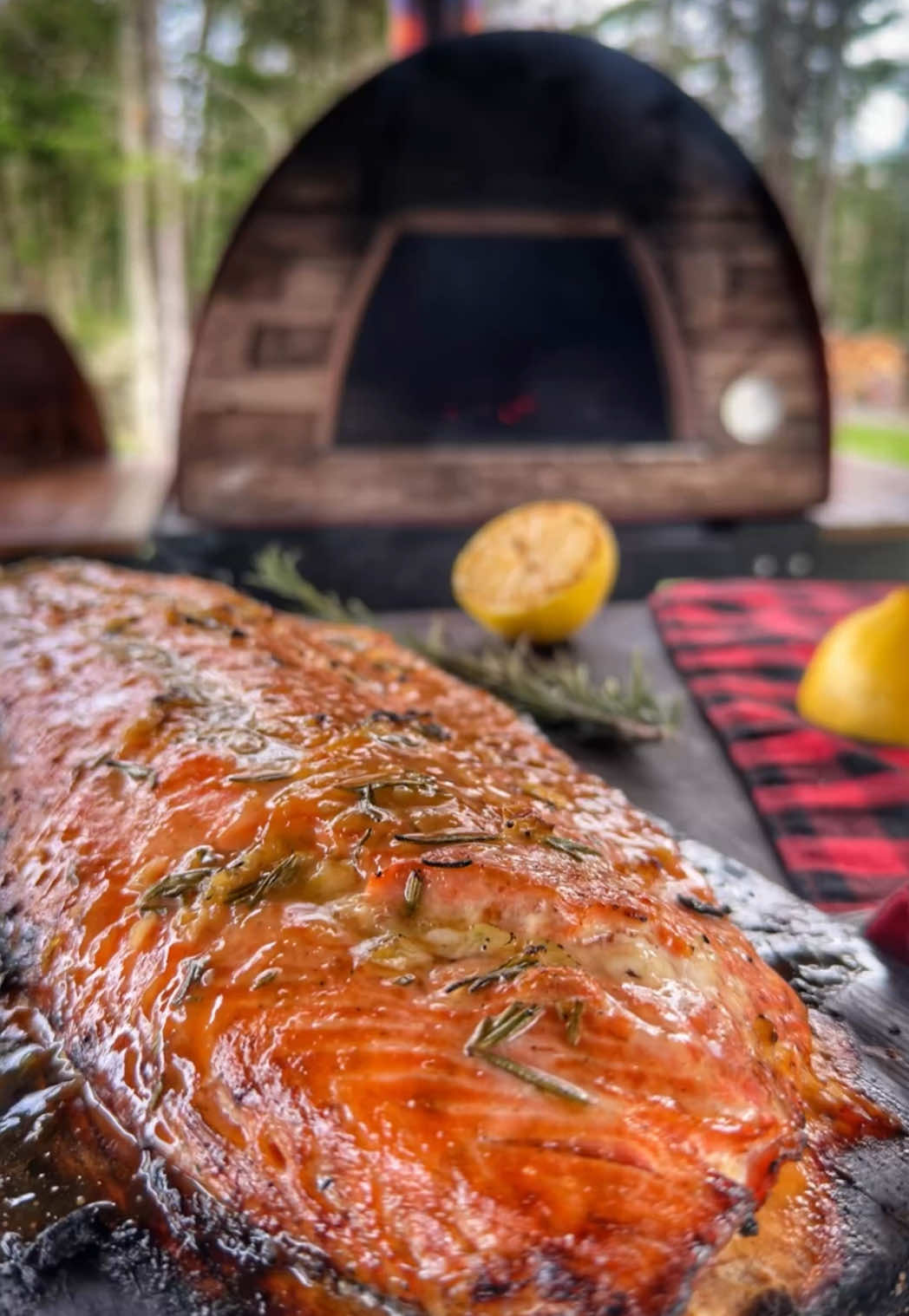 Smoky, crispy, tender salmon kissed by the flames of my @Authentic Pizza Ovens  finished with a browned butter glaze infused with lemon, rosemary, and maple. As a father, this is my happy place. If you want meals like this, you know what to get Dad for Father’s Day. 