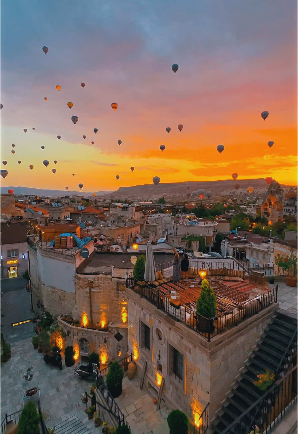 As the sun paints the sky in soft hues, hot air balloons drift silently… From our terrace, each sunrise feels like a scene from a dream #cappadocia #hotel #luxuryhotel #sunrise 