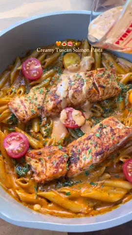 Creamy tuscan salmon pasta 🍣🍝✨ Ingredients: -500g pasta -1 onion -4 garlic cloves -Tomato puree  -Salmon fillets -Spinach  -Double cream -Salt -Black pepper -Paprika -Garlic powder -Mixed herb seasoning  -Oregano -Parsley  Method:  1. Season your salmon with salt, black pepper, paprika and garlic powder. Cook on a pan or air-fry on 180* for 20 mins.  2. To a pan, heat some oil and add 1 diced onion and minced garlic. Add 4tbsp of tomato puree and cook this down on low medium heat for 5 mins. 3. Boil your pasta on the side and add some of the pasta water to your tomato base. Add 250ml of double cream.  4. Add your seasonings: 2tsp mixed herb, oregano, parsley and 1tsp salt and black pepper.  5. Leave this to simmer for 10 mins and some spinach in and your pasta. Top with your salmon.  serve and enjoy #fyp #pasta #pastarecipe 